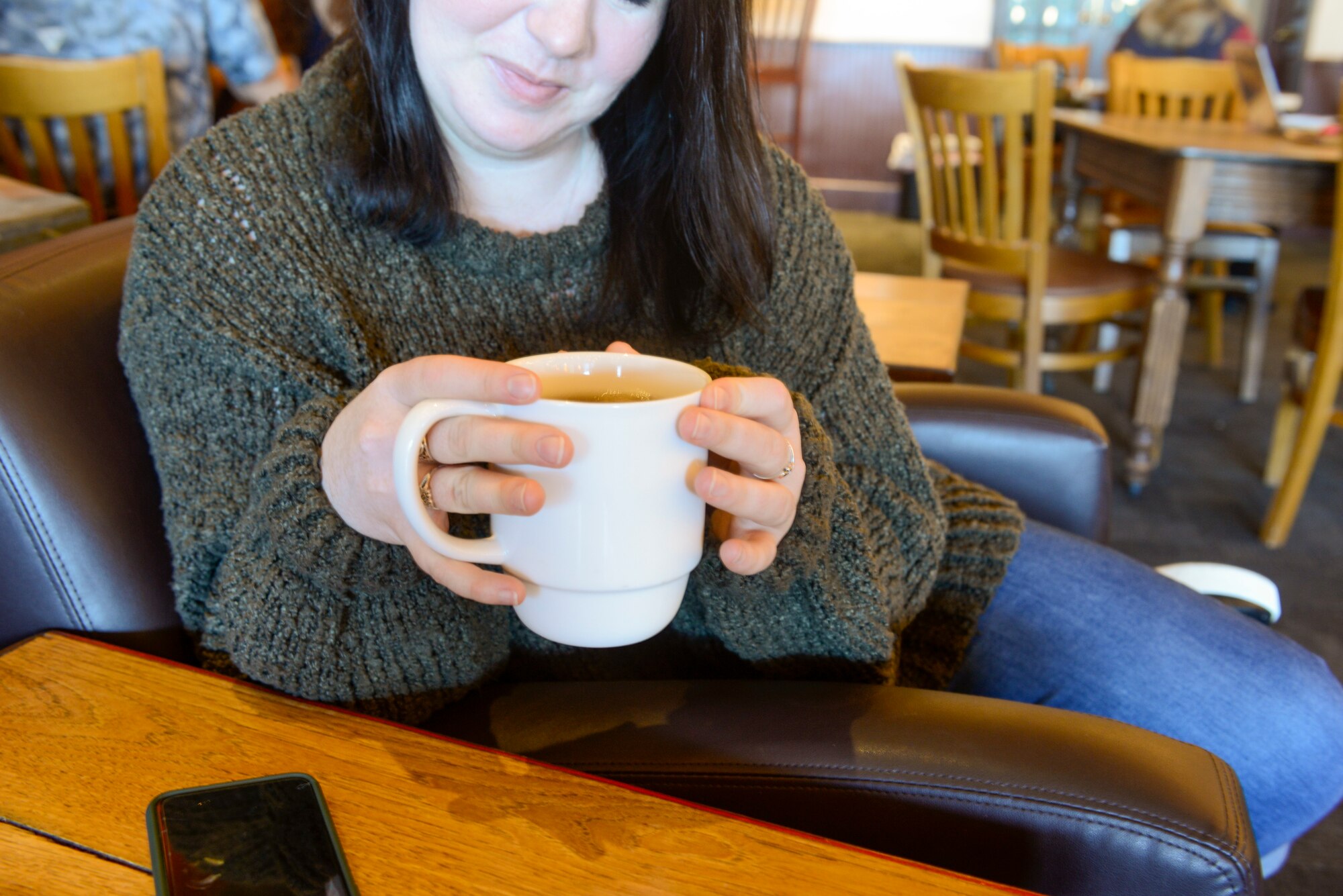U.S. Air Force Staff Sgt. Mikhaila Brown, national tactical integration analyst with the 381st Intelligence Squadron, enjoys a cup of coffee April 25, 2021, in Anchorage, Alaska.