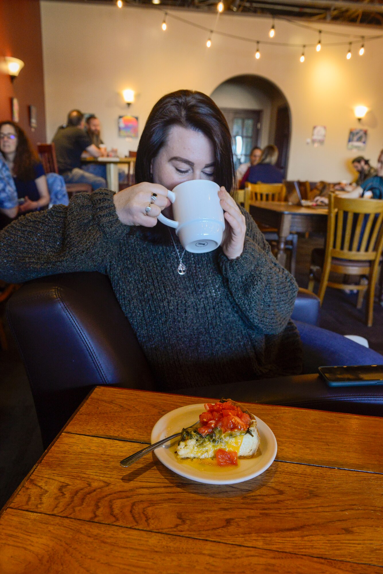 U.S. Air Force Staff Sgt. Mikhaila Brown, national tactical integration analyst with the 381st Intelligence Squadron, enjoys a cup of coffee April 25, 2021, in Anchorage, Alaska.