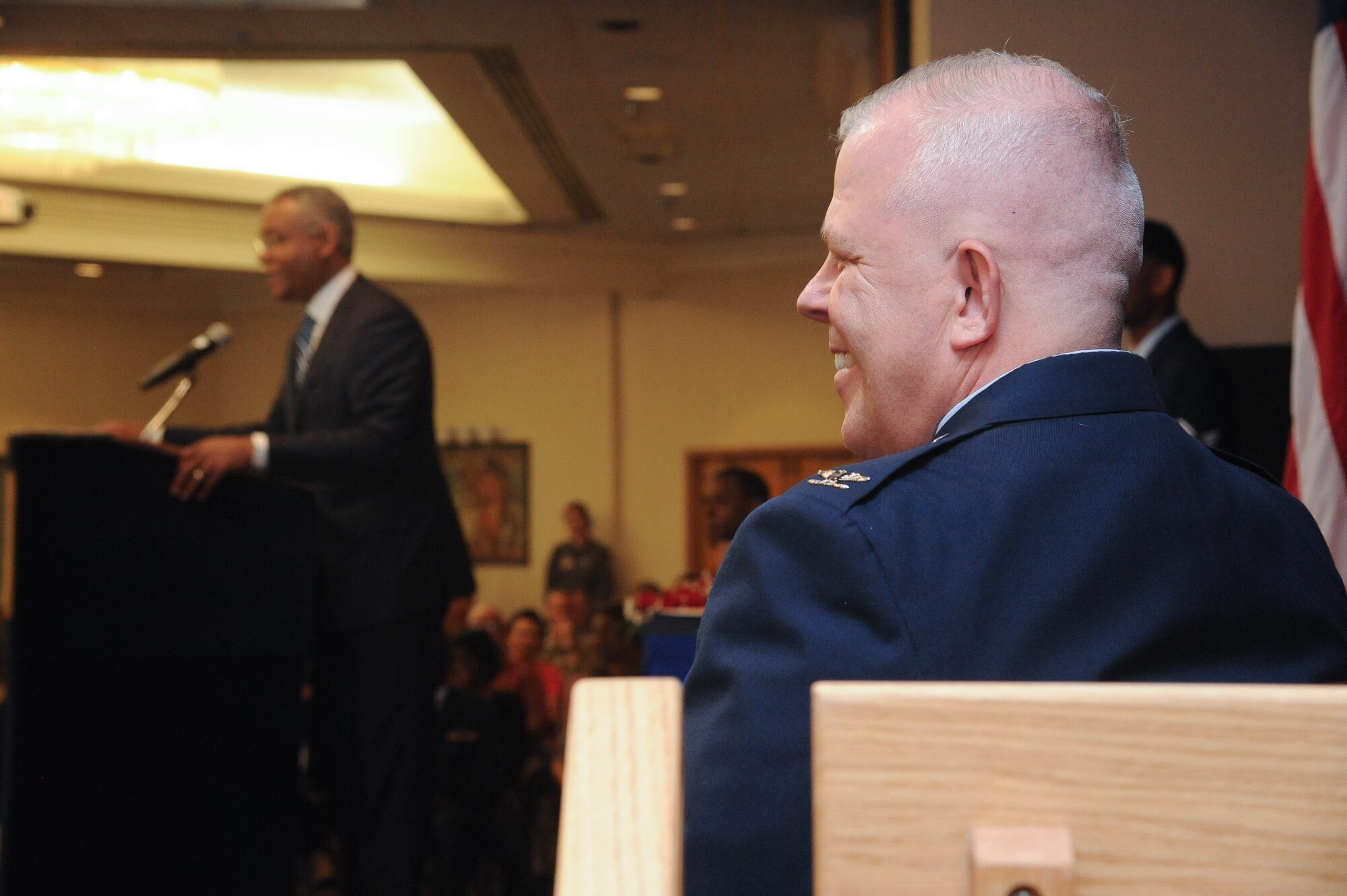 Col. Christopher J. King, right, smiles widely as retired Maj. Gen. Everett H. Thomas, left, shares a humorous anecdote during King’s retirement ceremony June 4, 2021, at Kirtland Air Force Base, New Mexico, after 36 years on active duty. King was the center’s vice commander from June 2020 to June 2021. (Air Force photo by Todd Berenger)