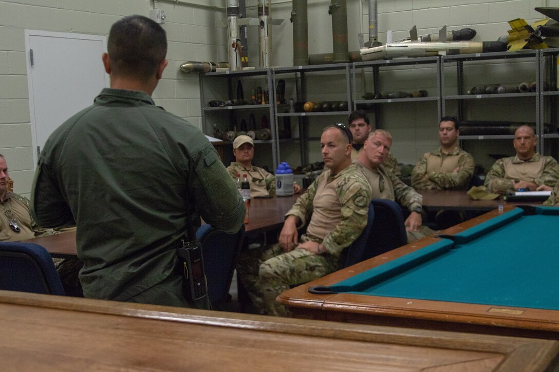 U.S. Marine Corps Master Sgt. Carlos Villarreal, the senior noncommissioned officer-in-charge with Explosive Ordnance Disposal (EOD), Headquarters and Headquarters Squadron, teaches a class to Carteret County Special Forces Response Team prior to joint training at Marine Corps Air Station Cherry Point, North Carolina, June 9, 2021. The training involved an ordnance range intended to demonstrate the explosive effects of different ordnance materials, allowing local law enforcement to better identify materials and understand the appropriate times to employ EOD. (U.S. Marine Corps photo by Lance Cpl Symira Bostic)