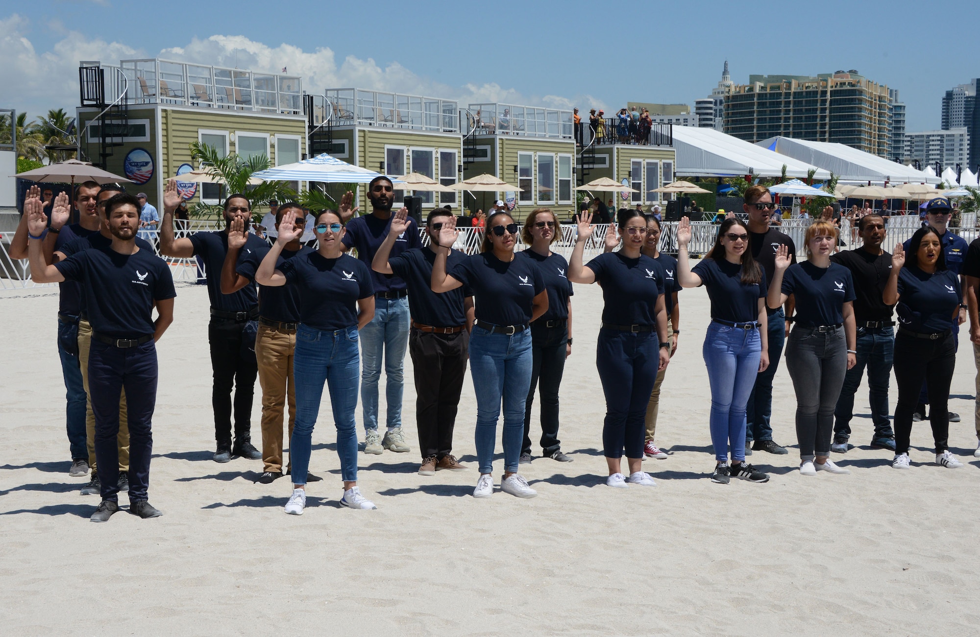 Air Force Delayed Entry Program members performed their oath of enlistment on Miami Beach as part of a mass joint enlistment during the Miami Beach Air Show, May 28, 2021.