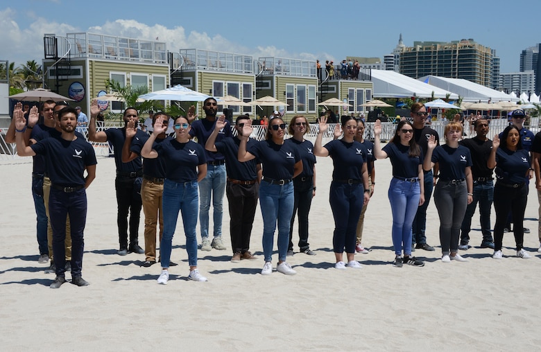 Air Force Delayed Entry Program members performed their oath of enlistment on Miami Beach as part of a mass joint enlistment during the Miami Beach Air Show, May 28, 2021.