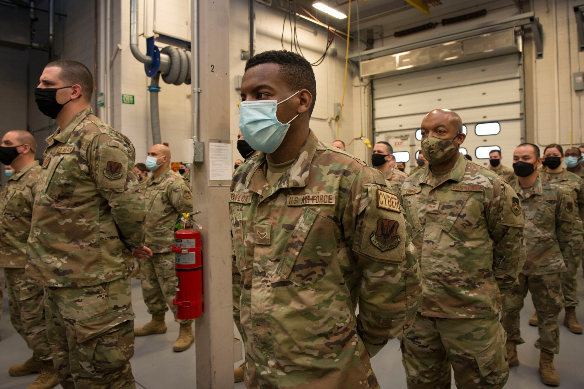 Members of the Connecticut Air National Guard, 103rd Air Control Squadron stand in formation during a briefing by Maj. Gen. Fran Evon, The Adjutant General of the Connecticut National Guard, April 15, 2021 in Orange, Connecticut. Members of 103rd ACS deployed to multiple locations in Southwest Asia and the United States in support of Operation Inherent Resolve and Mission Resolute Support. (U.S. Air National Guard photo by Master Sgt. Tamara R. Dabney)