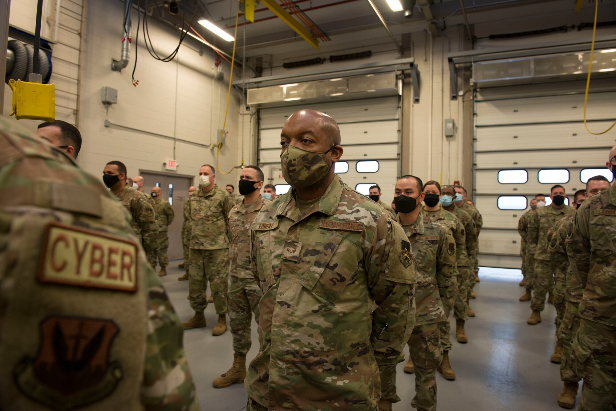 Members of the Connecticut Air National Guard, 103rd Air Control Squadron stand in formation during a briefing by Maj. Gen. Fran Evon, The Adjutant General of the Connecticut National Guard, April 15, 2021 in Orange, Connecticut. Members of 103rd ACS deployed to multiple locations in Southwest Asia and the United States in support of Operation Inherent Resolve and Mission Resolute Support. (U.S. Air National Guard photo by Master Sgt. Tamara R. Dabney)