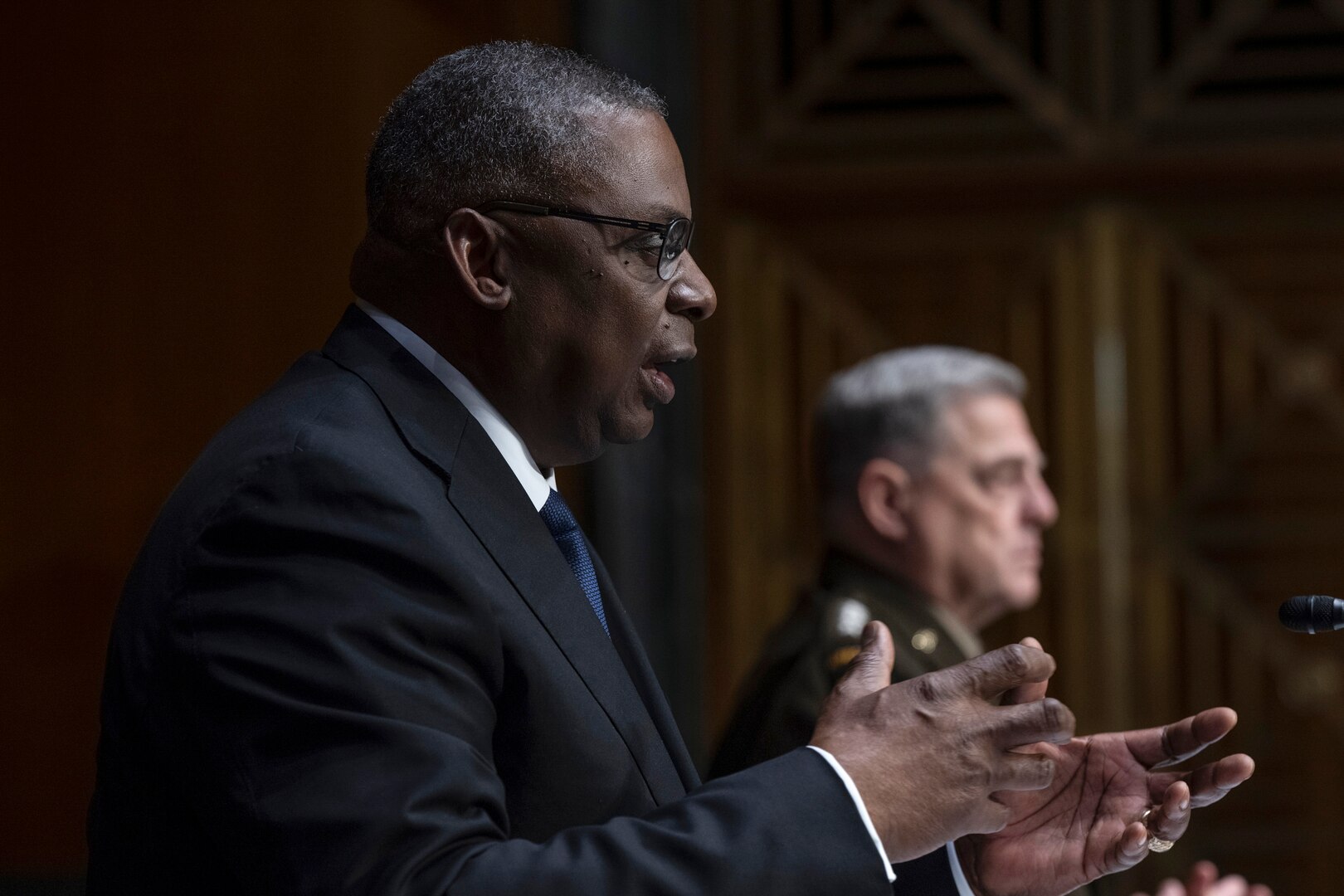 Secretary Austin gestures while speaking to the Senate committee.