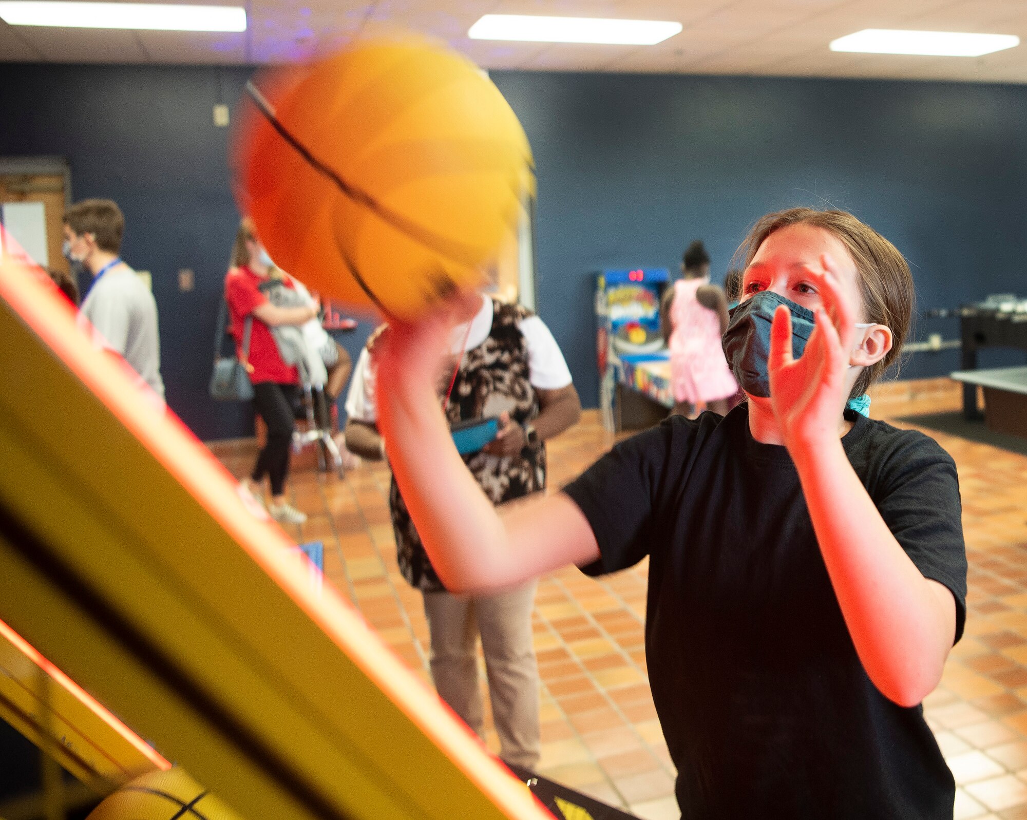 Evelyn Wilbern, 12, tries to beat the clock as she shoots baskets in the new Prairies Youth Center game room at Wright-Patterson Air Force Base, Ohio, on June 10, 2021. The venue, which features free arcade games, is having its grand opening June 18. (U.S. Air Force photo by R.J. Oriez
