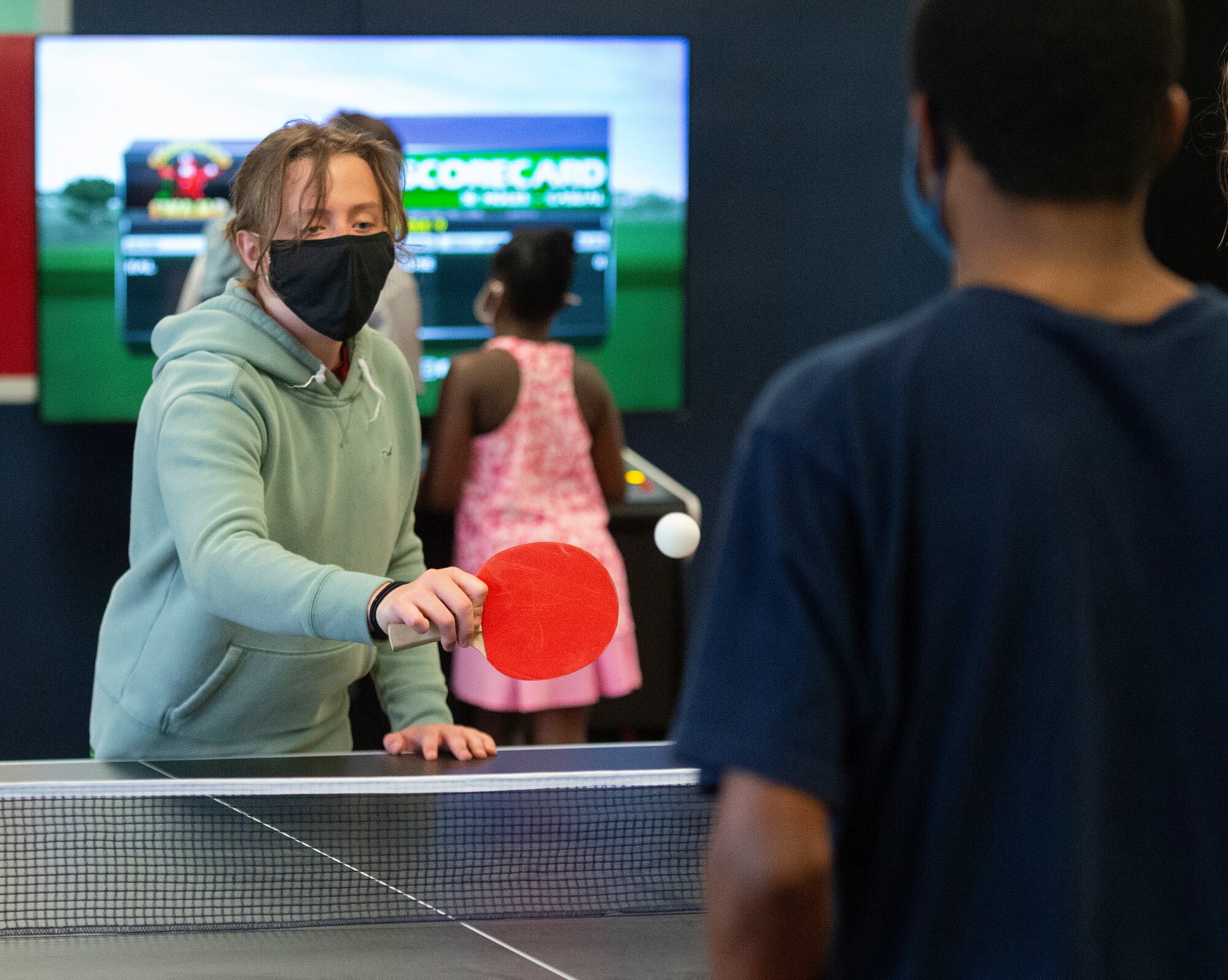 Brennen Rice, 11, returns a shot to Matthew Williams, 17, during a game of pingpong June 10, 2021. The two were competing in the new game room opening at the 88th Force Support Squadron’s Prairies Youth Center. (U.S. Air Force photo by R.J. Oriez)