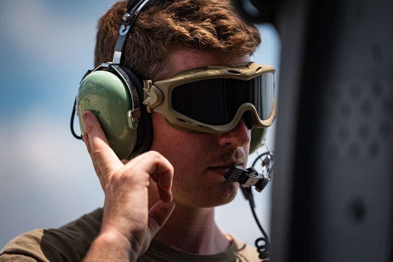An Airman uses a headset