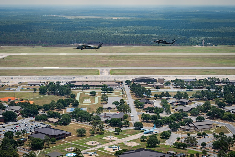 Two rescue helicopters fly over Moody Air Force Base