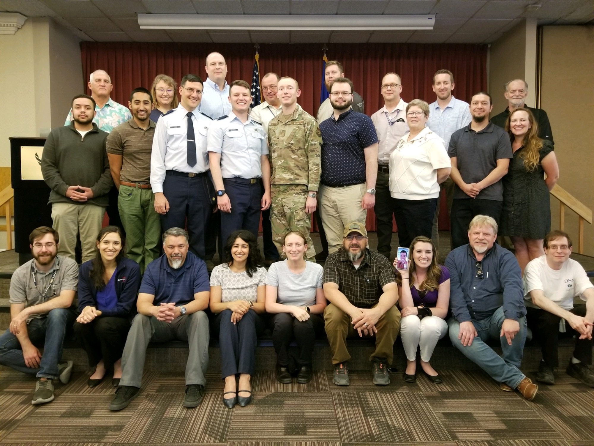 Past and present members of the Air Force Research Laboratory Space Vehicles Directorate’s Demonstration and Science Experiments spacecraft Integration & Test, operational, and contracting support teams gather for the DSX end of life celebration June 7 at Kirtland AFB, N.M. (Courtesy photo/AFRL)