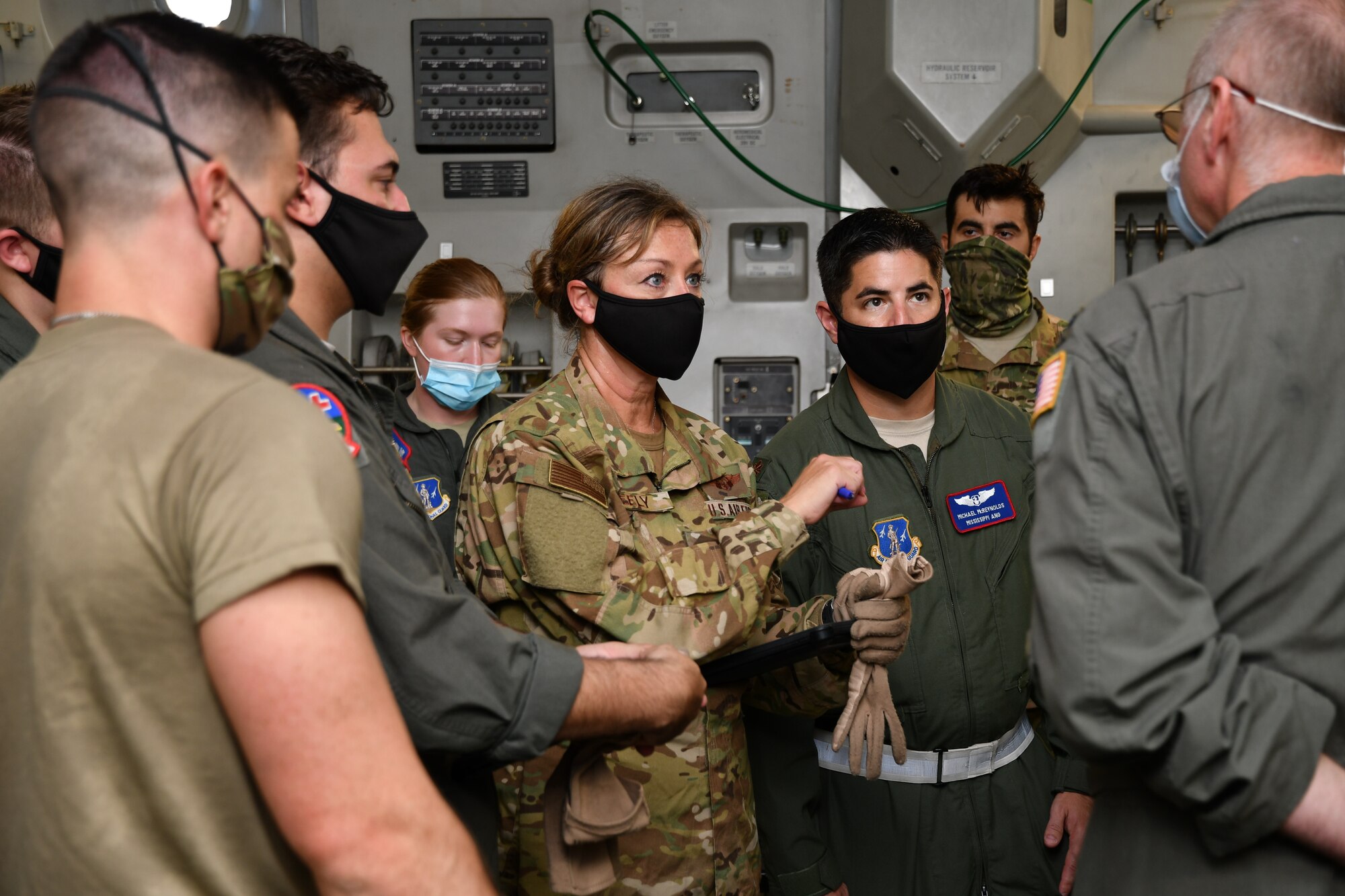 Lt. Col. Terri Dawn Neely, a flight nurse with the 183rd Aeromedical Evacuation Squadron, discusses flight plans aboard a C-17 Globemaster III with Lt. Col. David Delisle, a pilot with the 172nd Airlift Squadron, during a training exercise at the Mississippi Air National Guard’s Combat Readiness and Training Center in Gulfport, Mississippi, July 20, 2020. During the exercise, aeromedical evacuation crews from the 183rd AES and the 36th AES flew two training missions aboard C-17s from the 172nd Airlift Wing, headquartered in Jackson, Mississippi, and one training mission aboard a C-130 Hercules from the 403rd Wing, headquartered at Keesler Air Force Base. The training flights tested the ability of crews to provide in-flight care to numerous patients with various ailments, such as loss of vision, crushed extremities, abdominal lacerations and more. (U.S. Air National Guard Photo by Maj. Reagan B. Lauritzen)