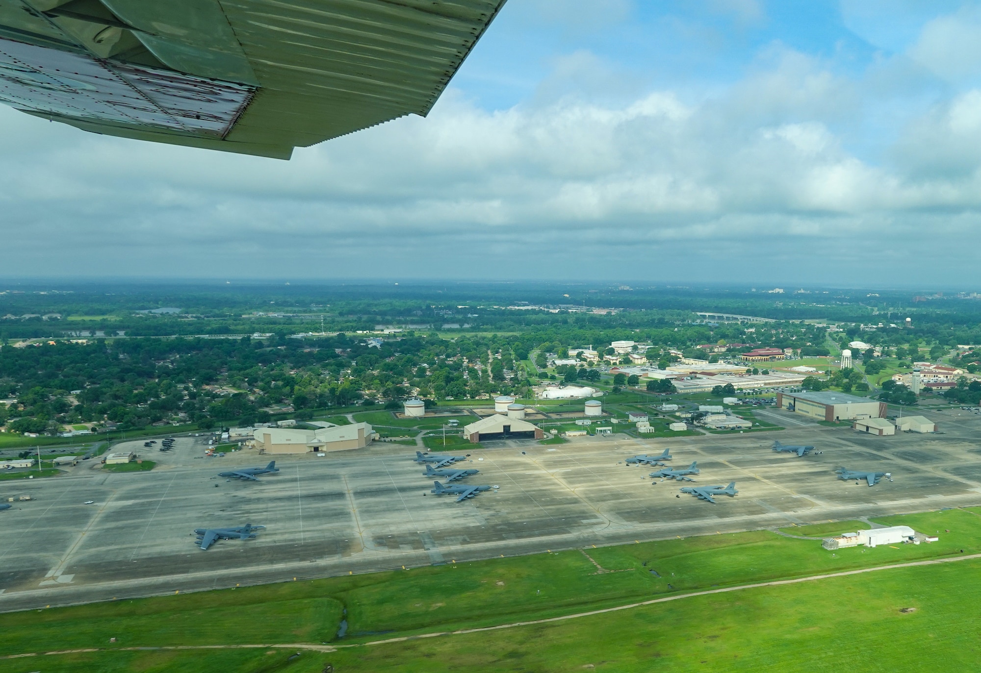 A Civil Air Patrol Cessna 182 Skylane, flies over the Barksdale flightline during a Mid-Air Collision Avoidance safety flight at Barksdale Air Force Base, Louisiana, May 28, 2021. MACA visits are conducted at various airports within a 50 nautical mile radius of Barksdale in which the CAP is tasked to move military personnel to help support Air Force mission safety requirements in different locations. (Courtesy photo by Capt. Dustin Martin)
