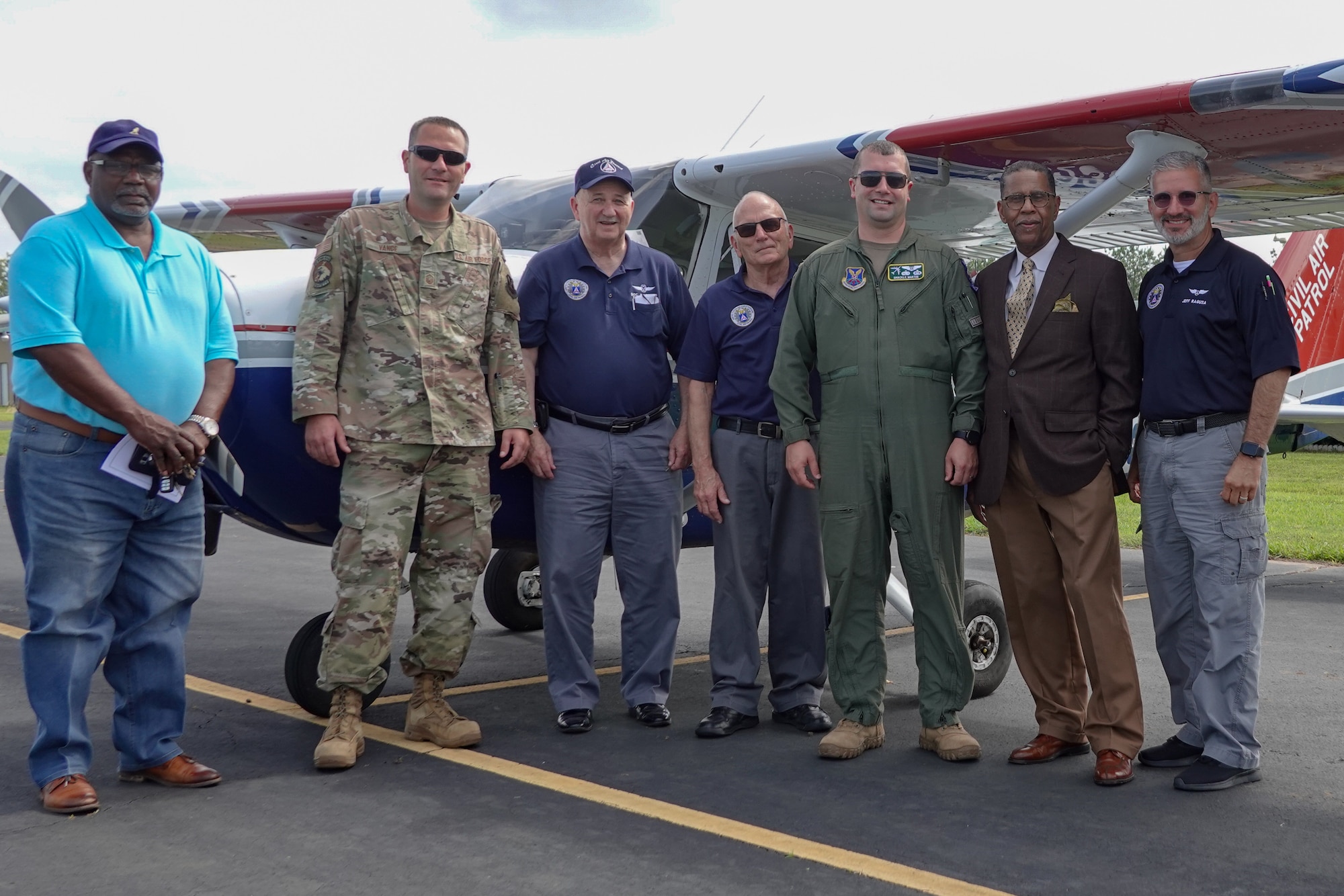 Airmen from the 2nd Bomb Wing flight safety office and members from the Shreveport Civil Air Patrol, pose for a photo at Jonesboro Airport during a Mid-Air Collision Avoidance safety training May 28, 2021. MACA is a program where members of the flight safety office travel to various airports spreading general awareness of hazards in the area, educating local aviators by answering their questions and avoiding mid-air collisions through preparedness. (Courtesy photo by Capt. Dustin Martin)