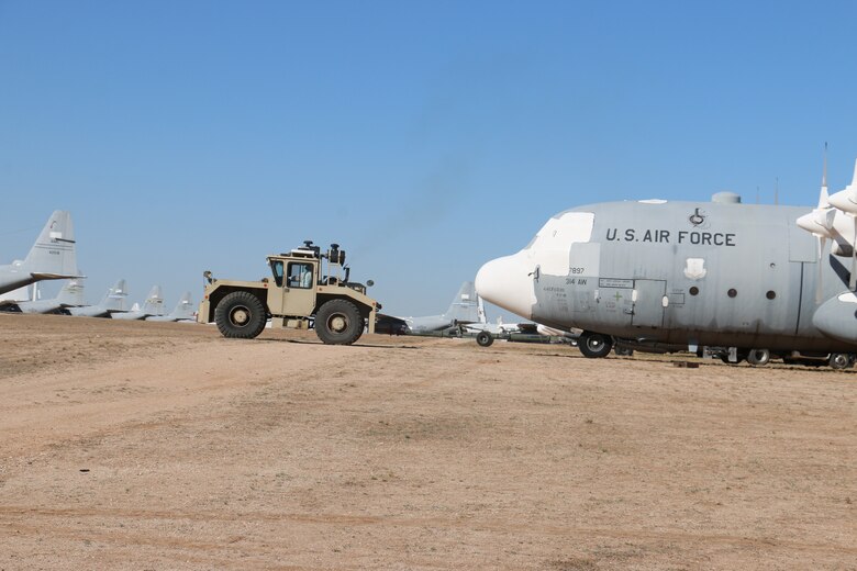 Personnel from the 309th Aerospace Maintenance and Regeneration Group move a stored aircraft at Davis-Monthan Air Force Base, Arizona, June 15, 2021.