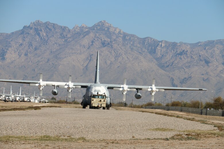 Personnel from the 309th Aerospace Maintenance and Regeneration Group move a stored aircraft at Davis-Monthan Air Force Base, Arizona, June 15, 2021.