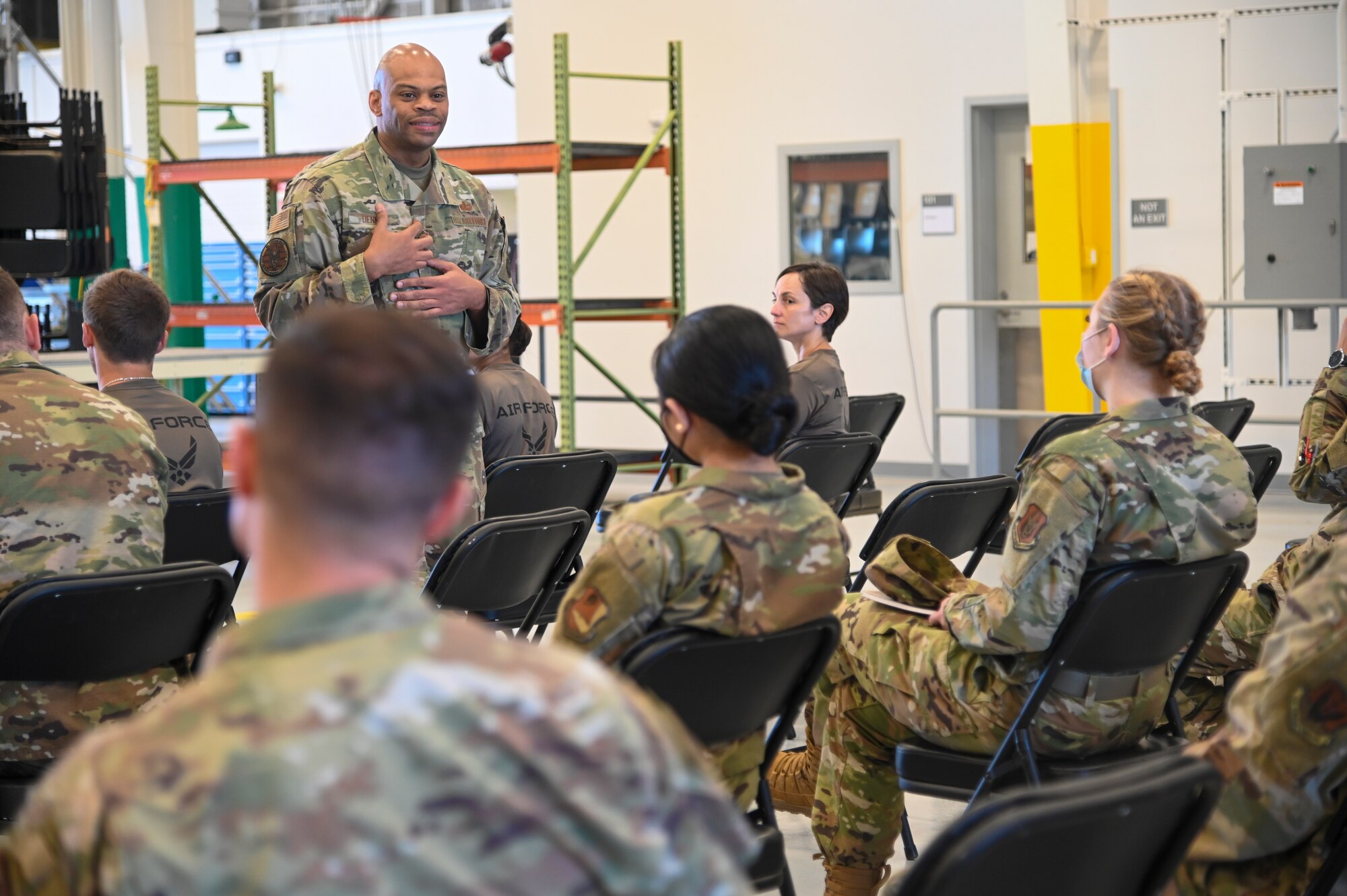 Chief Master Sgt. Travon W. Dennis, command first sergeant, Air Force Reserve Command, Robins Air Force Base, Georgia, speaks with Airmen at an E-4 and Below meeting June 13, 2021, at Beale AFB, California.
