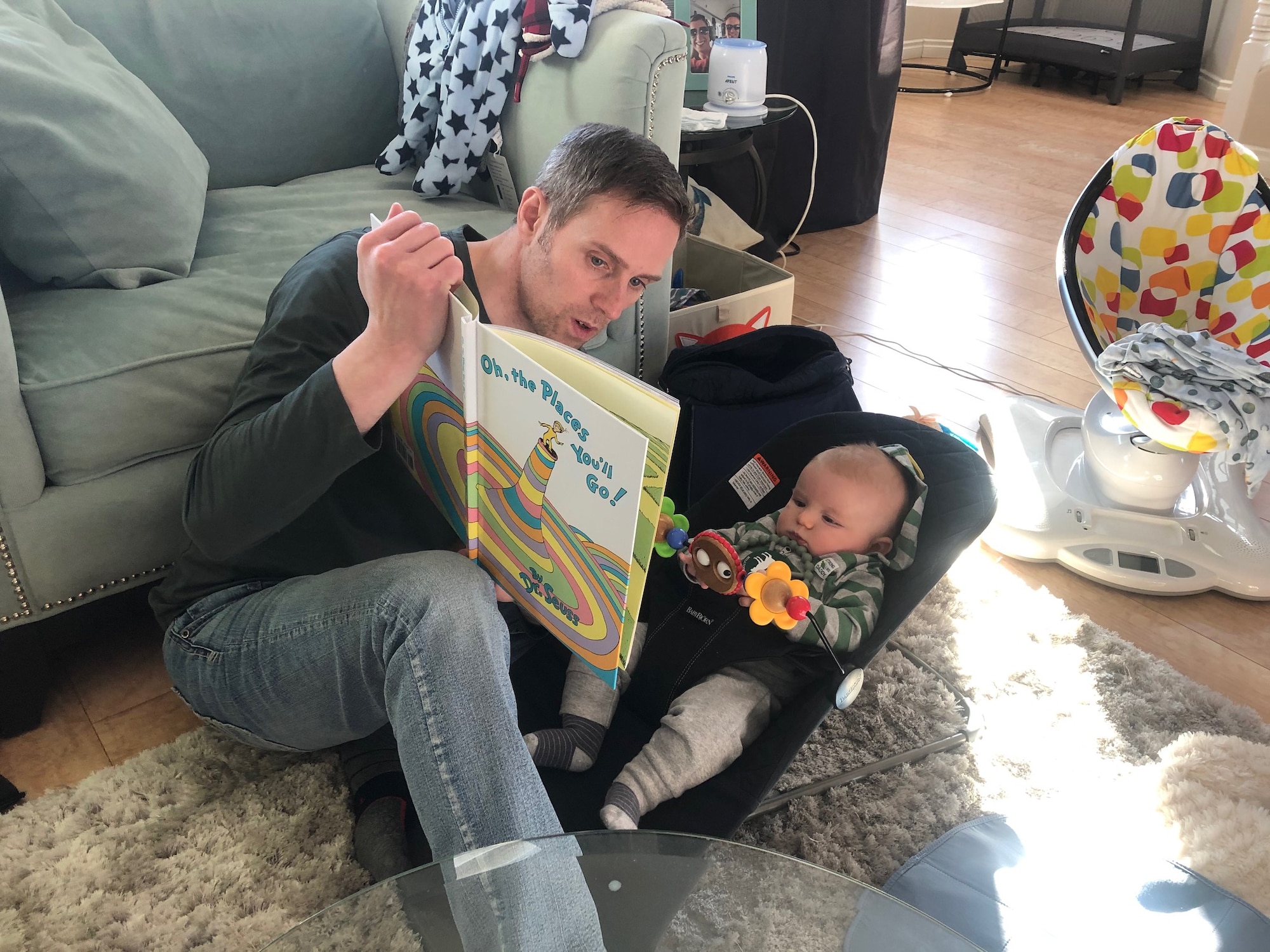 Nick Barnes reads to his son.