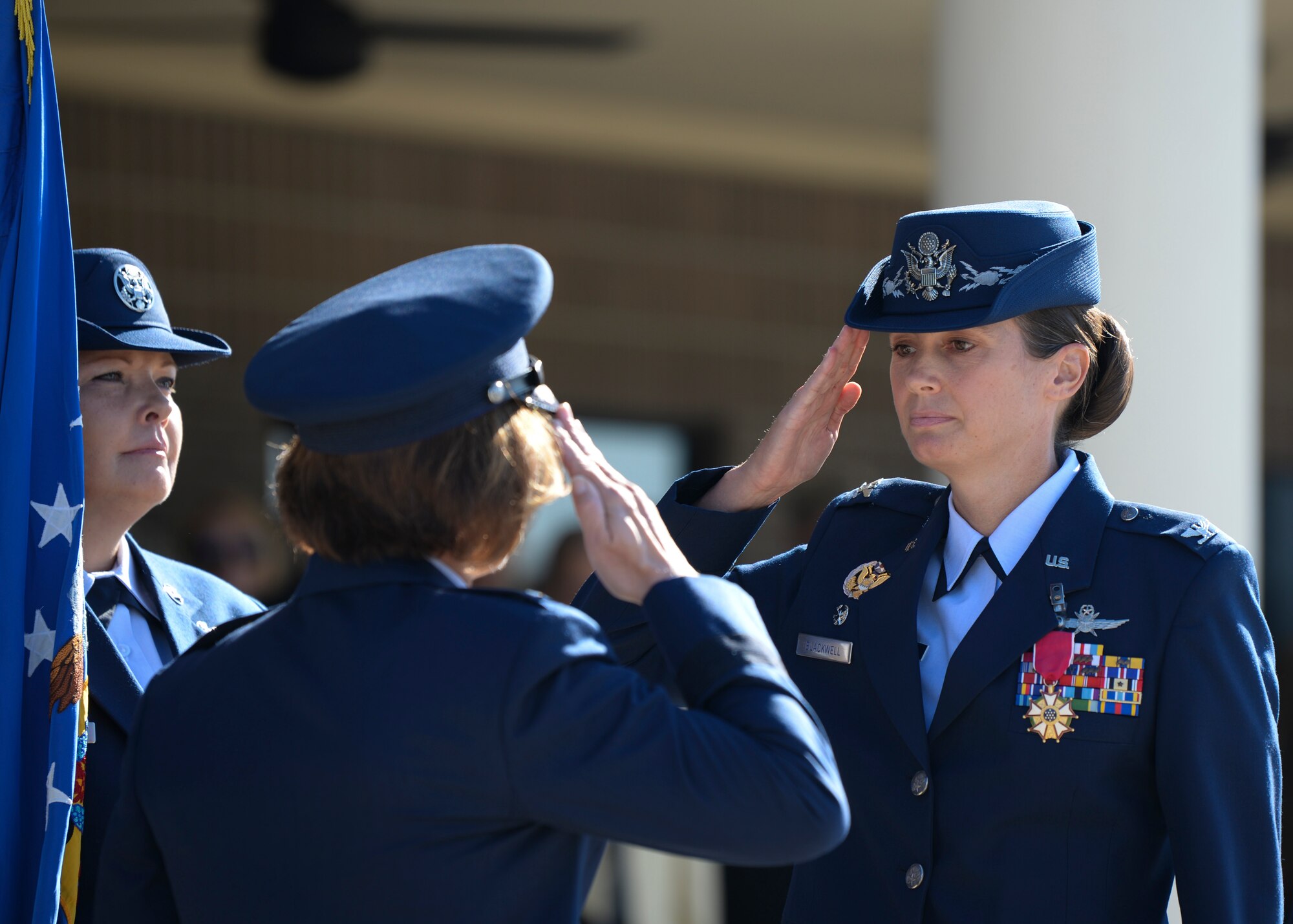 U.S. Air Force Col. Heather Blackwell, outgoing 81st Training Wing commander, salutes Maj. Gen. Andrea Tullos, Second Air Force commander, during the change of command ceremony on the Levitow Training Support Facility drill pad at Keesler Air Force Base, Mississippi, June 17, 2021. The ceremony is a symbol of command being exchanged from one commander to the next by the handing-off of a ceremonial guidon. Blackwell is now assigned to the Air Combat Command. (U.S. Air Force photo by Senior Airman Spencer Tobler)