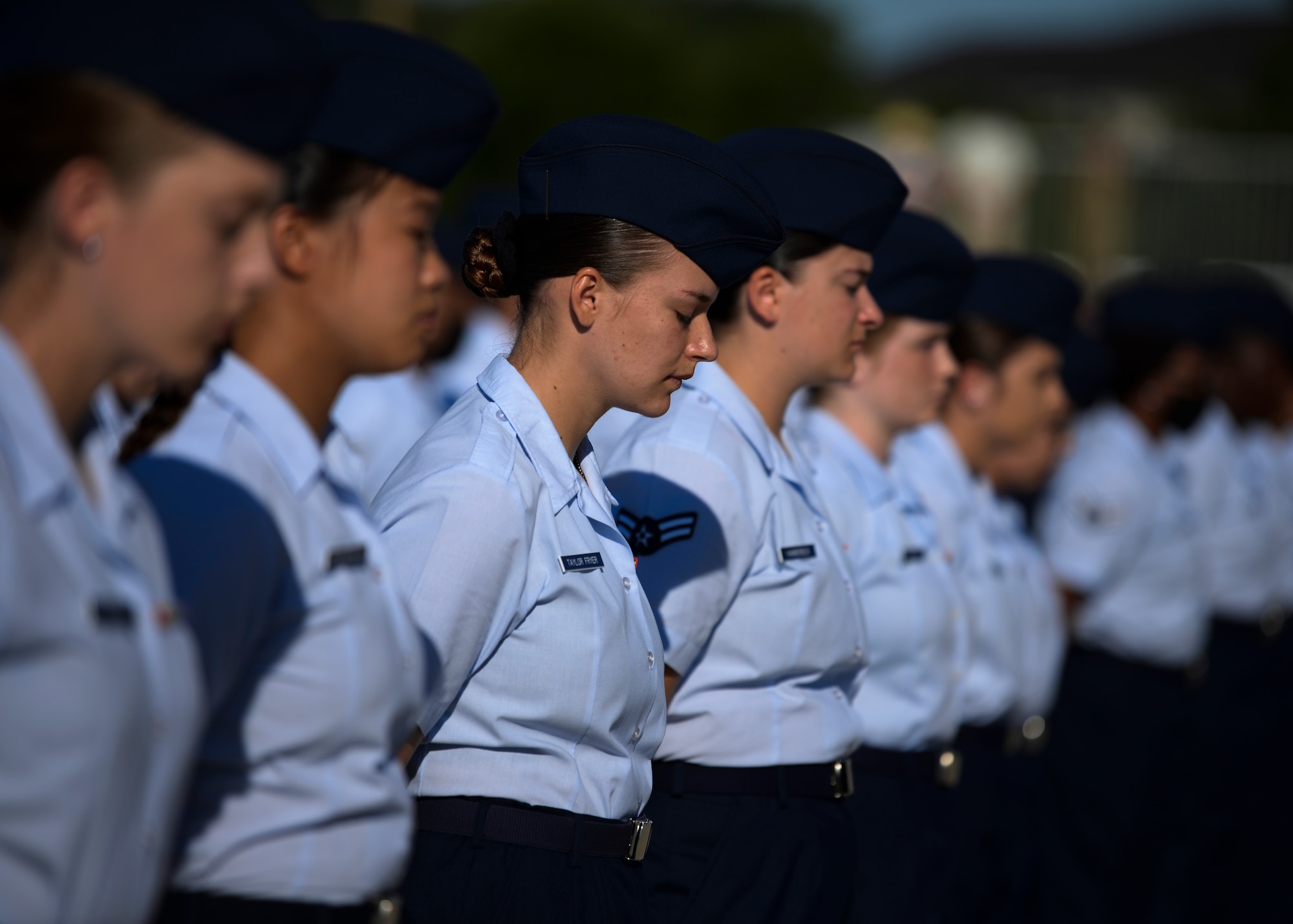 Airmen from the 81st Training Group stand in formation during the 81st Training Wing change of command ceremony on the Levitow Training Support Facility drill pad at Keesler Air Force Base, Mississippi, June 17, 2021. The ceremony is a symbol of command being exchanged from one commander to the next by the handing-off of a ceremonial guidon. U.S. Air Force Col. Heather Blackwell relinquished command of the 81st TRW to Col. William Hunter. (U.S. Air Force photo by Senior Airman Spencer Tobler)
