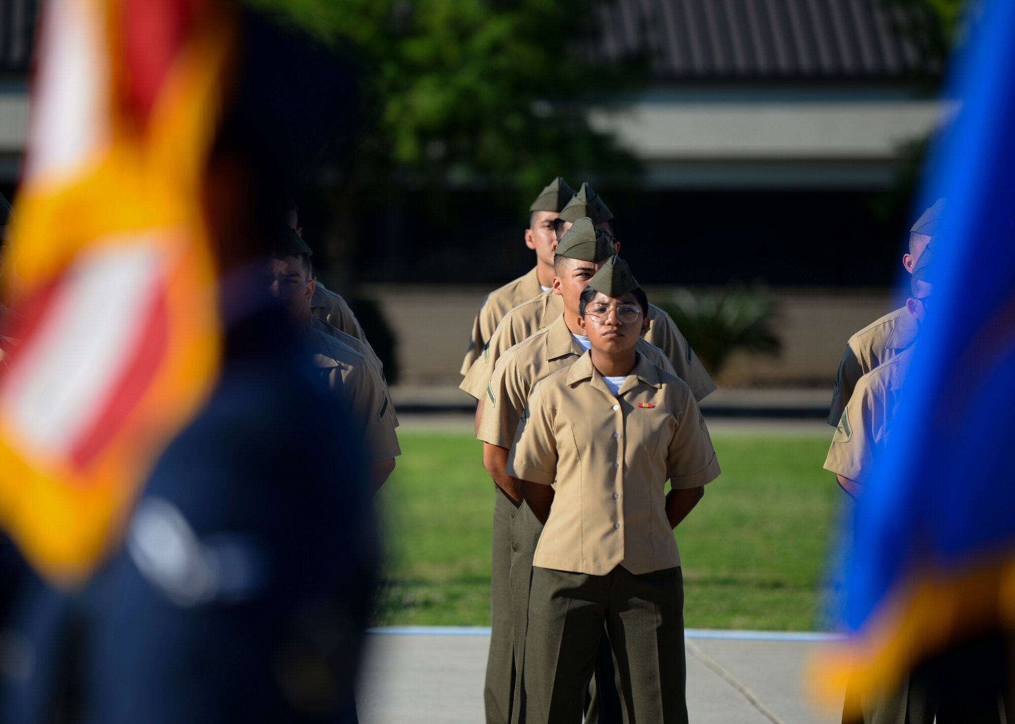 Marines from the 81st Training Group stand in formation during the 81st Training Wing change of command ceremony on the Levitow Training Support Facility drill pad at Keesler Air Force Base, Mississippi, June 17, 2021. The ceremony is a symbol of command being exchanged from one commander to the next by the handing-off of a ceremonial guidon. U.S. Air Force Col. Heather Blackwell relinquished command of the 81st TRW to Col. William Hunter. (U.S. Air Force photo by Senior Airman Spencer Tobler)
