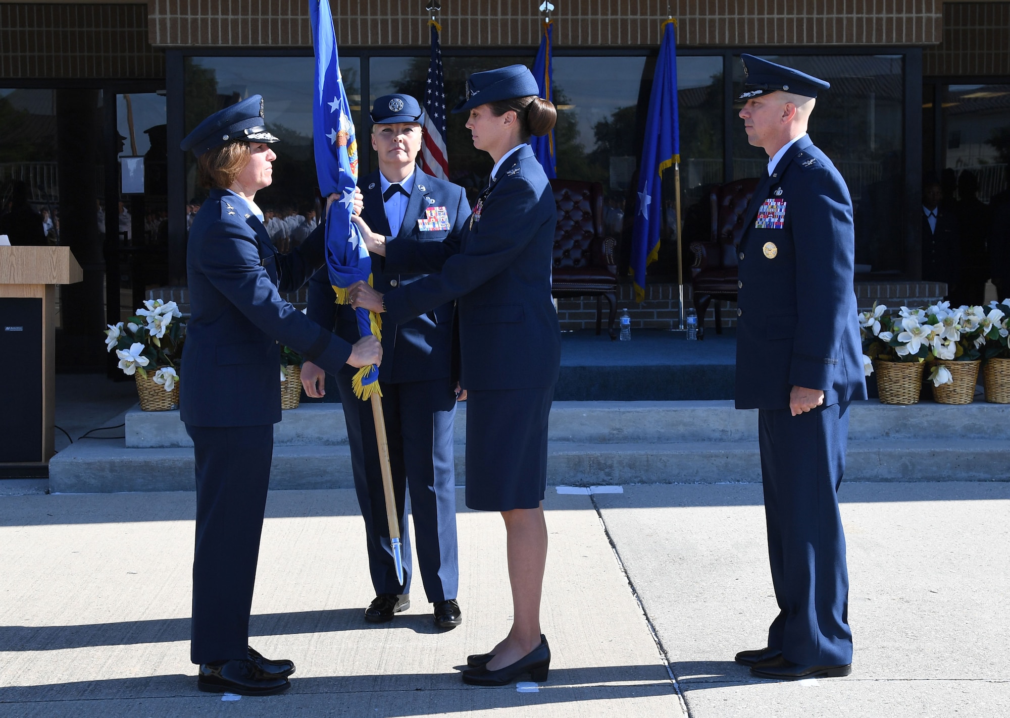 U.S. Air Force Maj. Gen. Andrea Tullos, Second Air Force commander, takes the guidon from Col. Heather Blackwell, outgoing 81st Training Wing commander, during the change of command ceremony on the Levitow Training Support Facility drill pad at Keesler Air Force Base, Mississippi, June 17, 2021. Blackwell is now assigned to the Air Combat Command. (U.S. Air Force photo by Kemberly Groue)