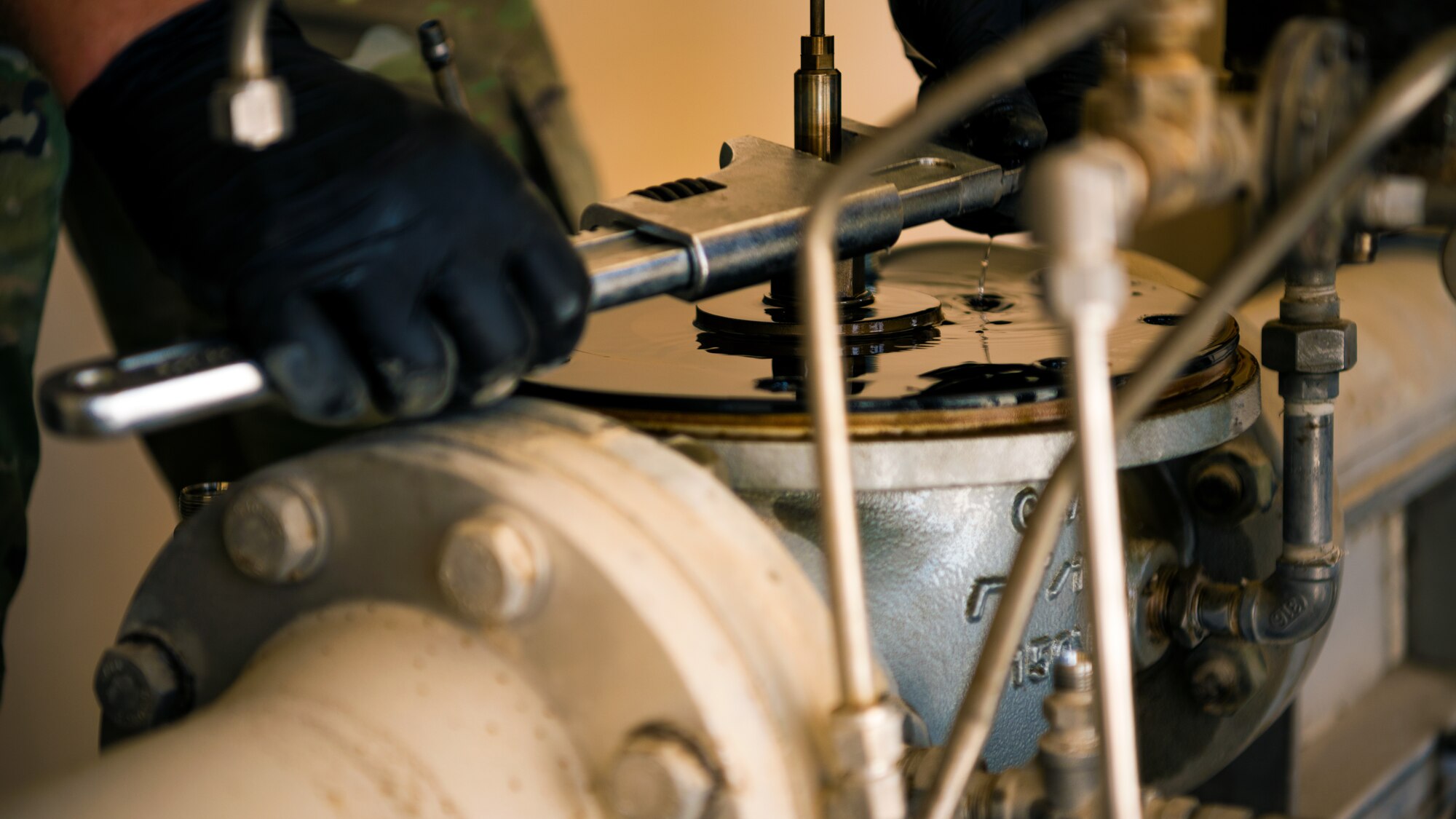 U.S. Air Force Airmen from the 380th Expeditionary Civil Engineer Squadron water & fuel systems maintenance and the 380th Expeditionary Logistic Readiness Squadron fuels flight perform maintenance on a fuels system at Al Dhafra Air Base, United Arab Emirates, June 14, 2021.