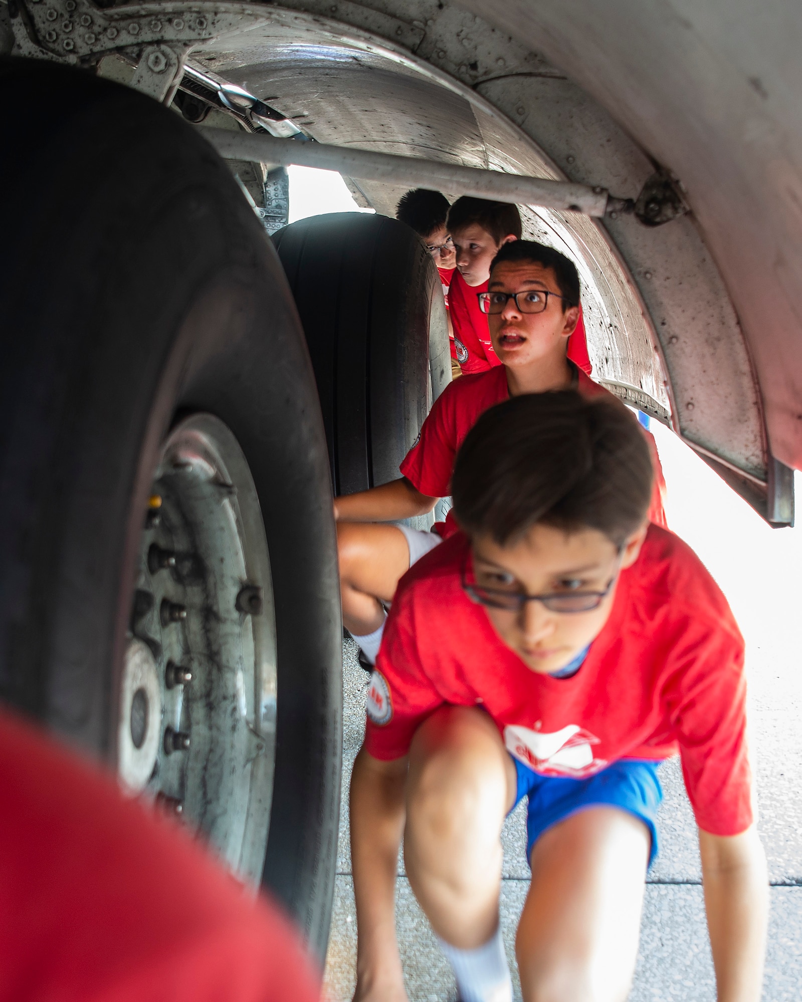 Air Camp participants get an up-close look at a C-17 Globemaster III aircraft’s landing gear and wheel well during a visit to Wright-Patterson Air Force Base, Ohio, on June 14, 2021. Air Camp is a STEM program aimed at promoting interest in aviation among middle school students. (U.S. Air Force photo by R.J. Oriez)