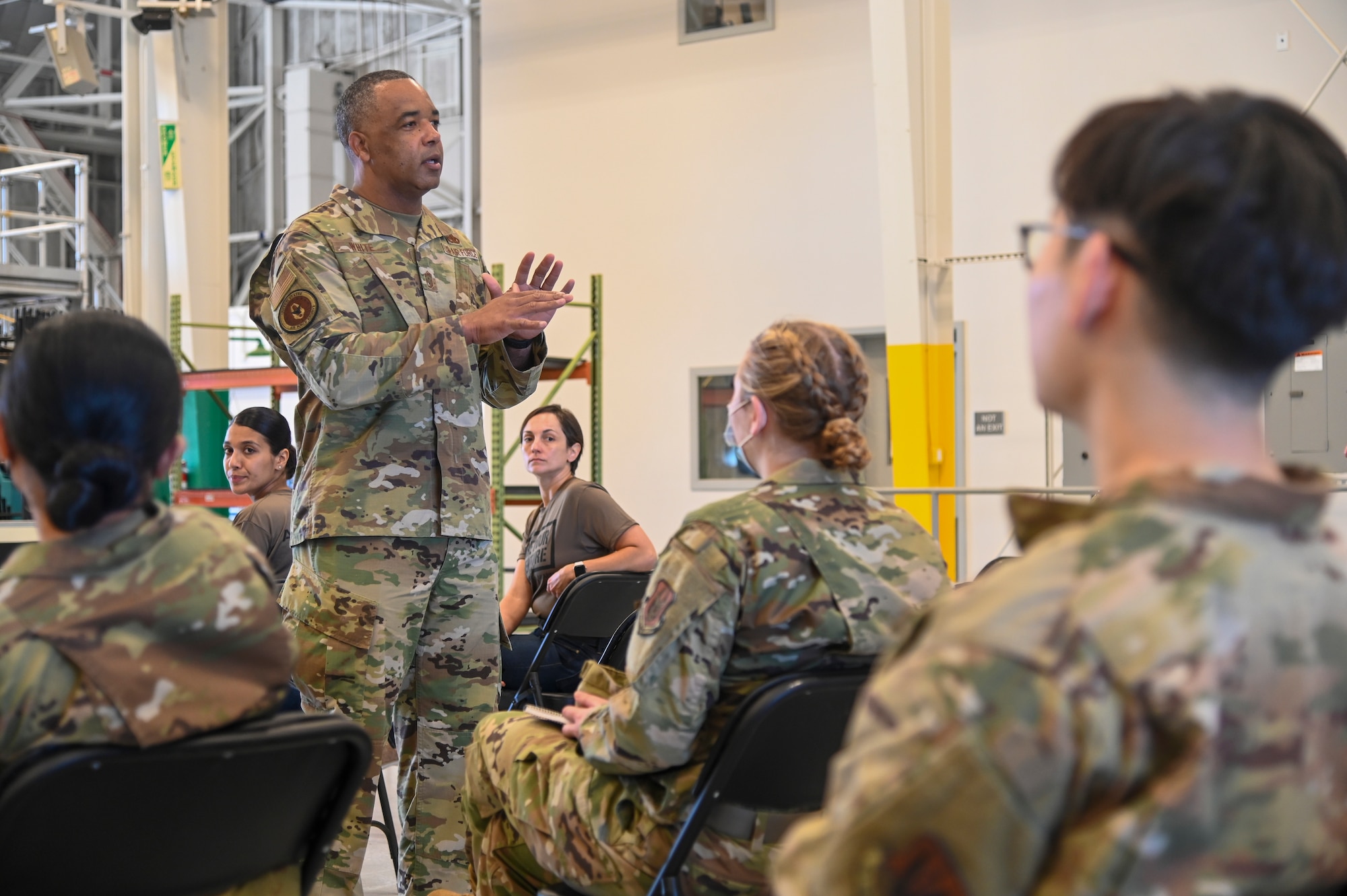 Chief Master Sgt. Timothy C. White Jr., command chief master sergeant, Air Force Reserve Command, Robins Air Force Base, Georgia, speaks with Airmen at an E-4 and Below meeting June 13, 2021, at Beale AFB, California.