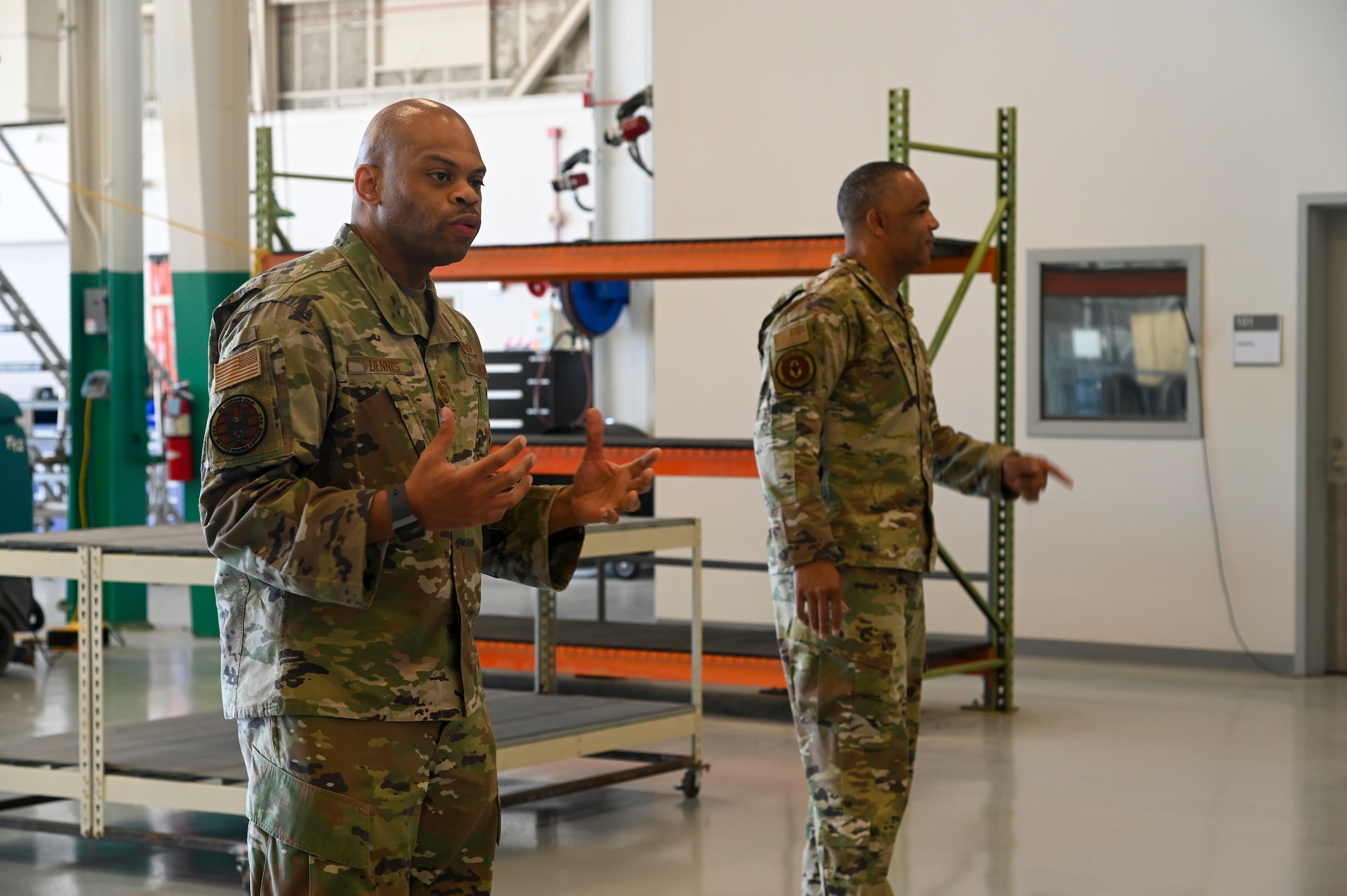 Chief Master Sgt. Timothy C. White Jr., command chief master sergeant, and Chief Master Sgt. Travon W. Dennis, command first sergeant, both from Air Force Reserve Command, Robins Air Force Base, Georgia, speak with 940th Air Refueling Wing maintainers June 12, 2021, at Beale AFB, California.