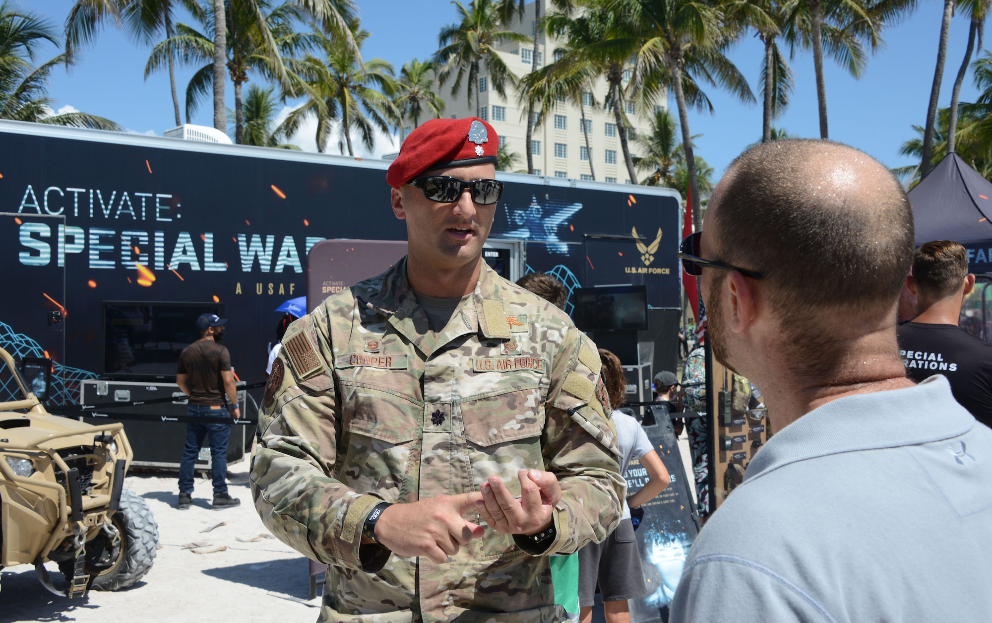 Lt. Col. Steven Cooper, 330th Recruiting Squadron commander, talks to visitor during  the Miami Beach Air Show, May 28, 2021.