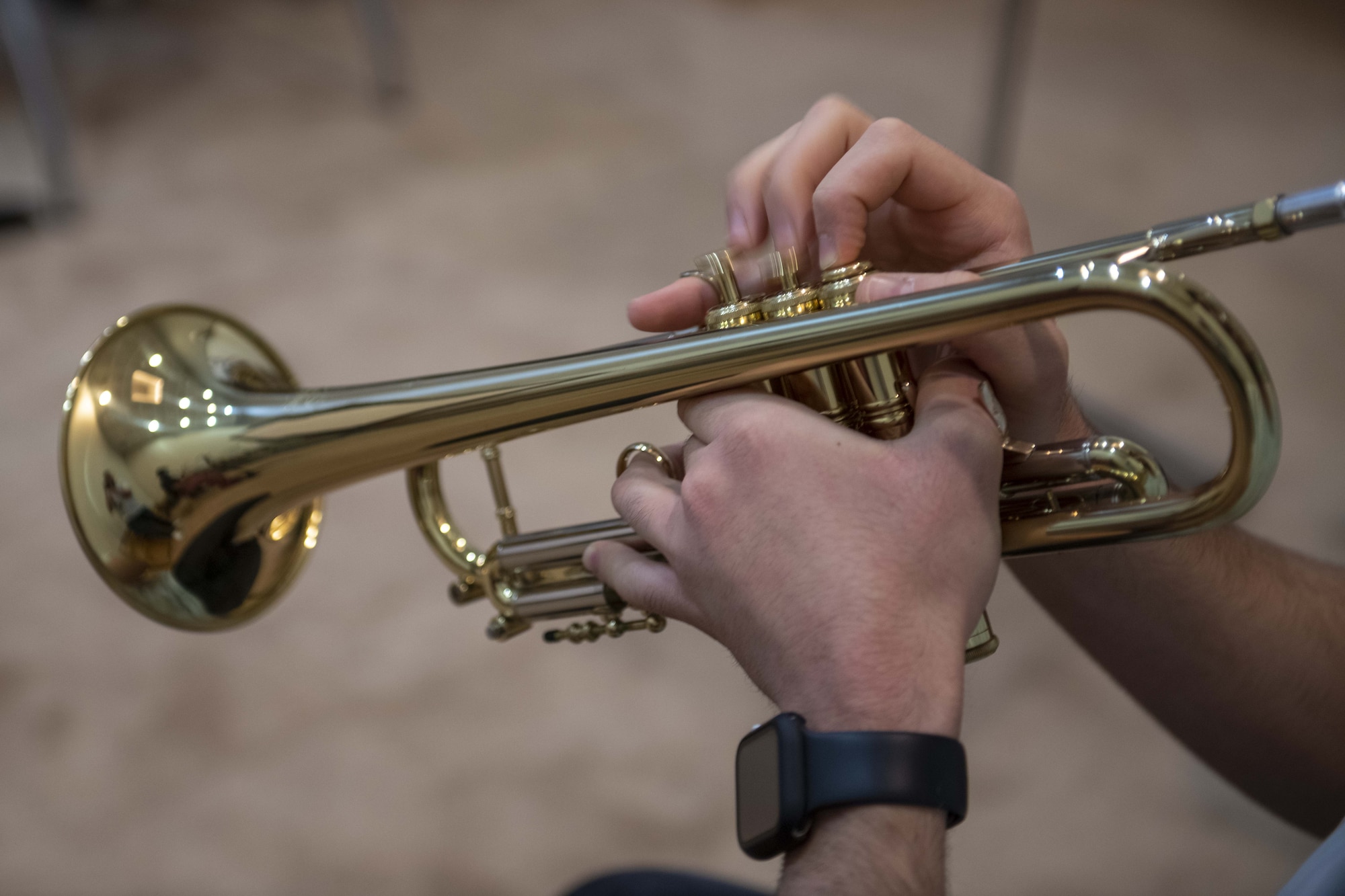 A wind player from the Qatar Youth Orchestra plays a trumpet during a class at the Qatar Music Academy, June 15, 2021, Doha, Qatar.  Members of the AFCENT Band worked with students during class and played alongside them during rehearsal. The AFCENT Band uses community engagement opportunities like school visits to share the Air Force mission through music. (U.S. Air Force photo by Tech. Sgt. Dylan Nuckolls)