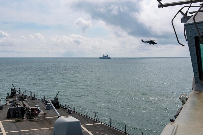 (June 17, 2021) An AgustaWestland AW159 Wildcat helicopter flies in front of the Arleigh Burke-class guided-missile destroyer USS Laboon (DDG 58) as Laboon operates in formation with the British Royal Navy’s Daring-class air-defence destroyer HMS Defender (D 36) and the Royal Netherlands Navy’s De Zeven Provincien-class frigate HNLMS Evertsen (FF 805), not pictured, in the Black Sea, June 17, 2021. Laboon is deployed to the U.S. Sixth Fleet area of operations in support of U.S. national security interests in Europe and Africa.