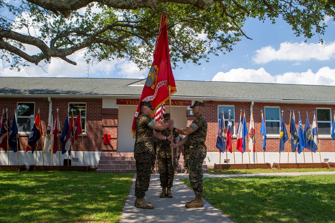 U.S. Marine Corps Lt. Col. Lynn W. Berendsen, right, the outgoing commanding officer of 2d Assault Amphibian Battalion, 2d Marine Division, relinquishes command to Lt. Col. John Kennedy, the incoming commanding officer, during a change of command ceremony on Camp Lejeune, N.C., June 17, 2021. The ceremony between commanding officers represents the transfer of authority, responsibility, and accountability. (U.S. Marine Corps photo by Pfc. Sarah Pysher)