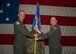 Air Force colonel passes unit guidon to another Air Force colonel