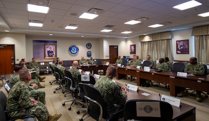 Adm. Christopher W. Grady, commander, U.S. Fleet Forces Command (USFFC), center, speaks with 17 command master chief petty officers during a Senior Enlisted Executive Leadership Symposium held at USFFC, June 15 - 17, 2021.