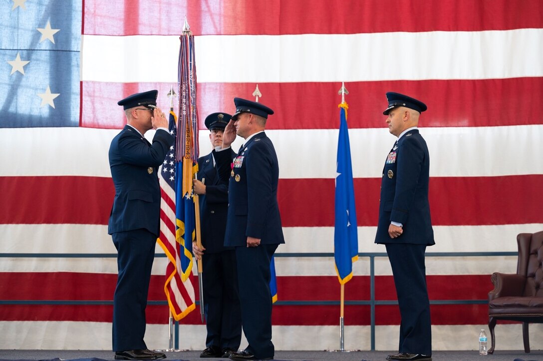 Maj. Gen. Mark E. Weatherington, 8th Air Force and Joint-Global Strike Operations Center commander, returns a salute from Col. David A. Doss, the outgoing 28th Bomb Wing commander, during the 28th BW change of command ceremony at Ellsworth Air Force Base, S.D., June 18, 2021.
