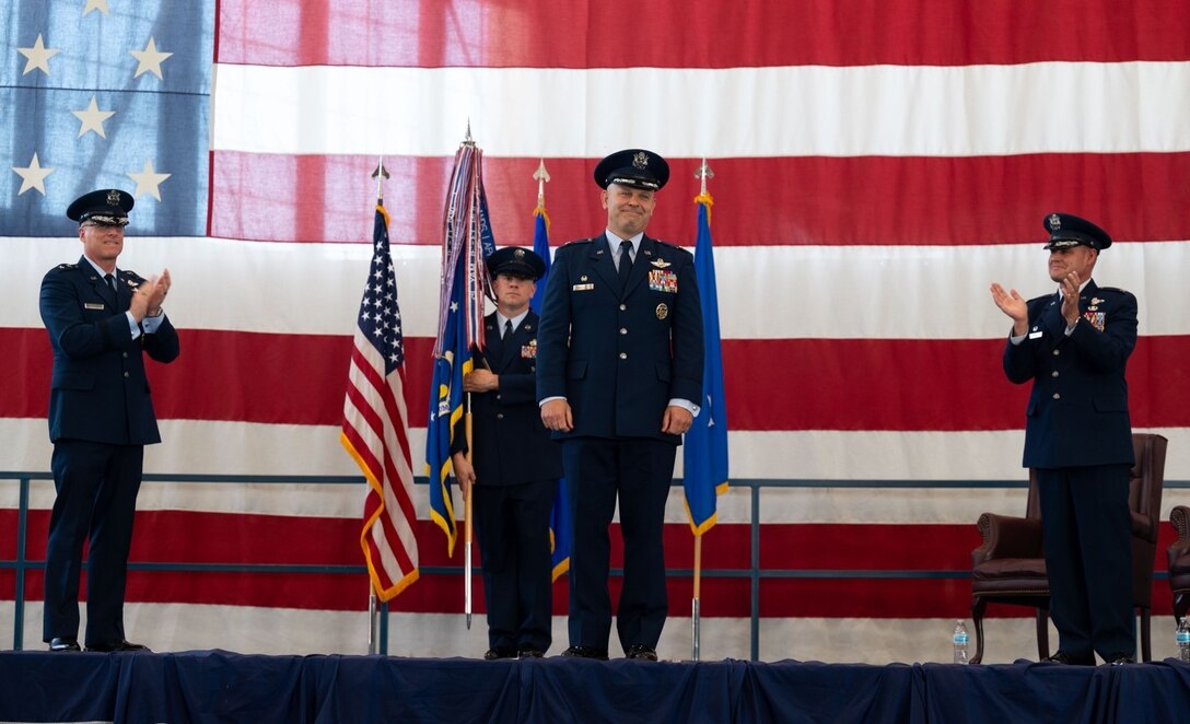 Col. Joseph L. Sheffield receives a round of applause during the 28th Bomb Wing change of command ceremony at Ellsworth Air Force Base, S.D., June 18, 2021