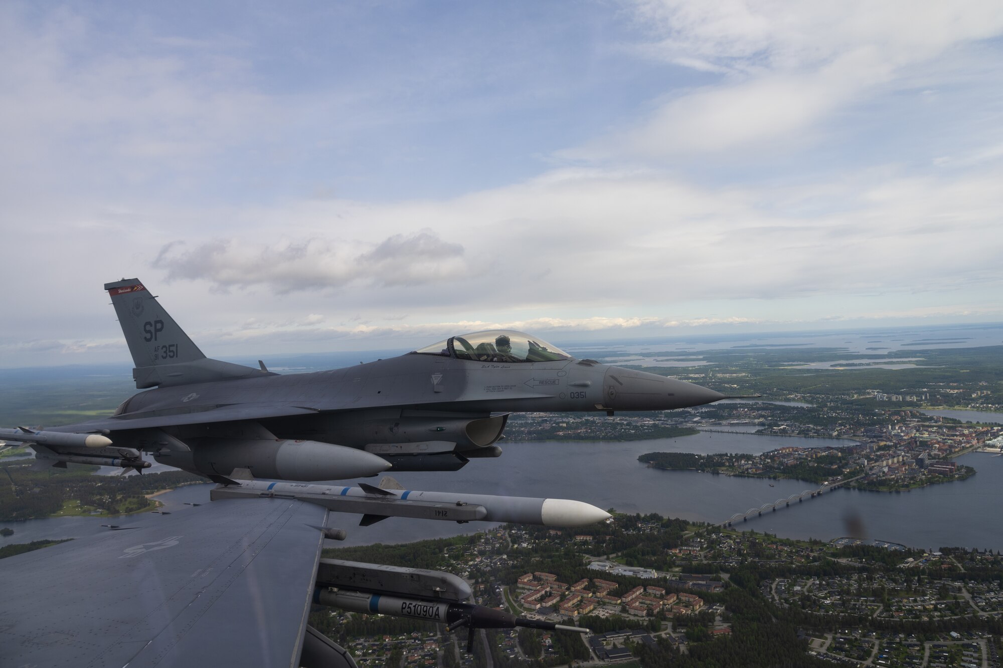 Two U.S. Air Force F-16 fly in formation over Luleå, Sweden, June 14, 2021. Exercises like the Arctic Challenge Exercise 2021 give USAF participants the opportunity to build partnerships, train with Nordic Allies, and maximize interoperability within the Nordic region. (U.S. Air Force photo by Senior Airman Ali Stewart)