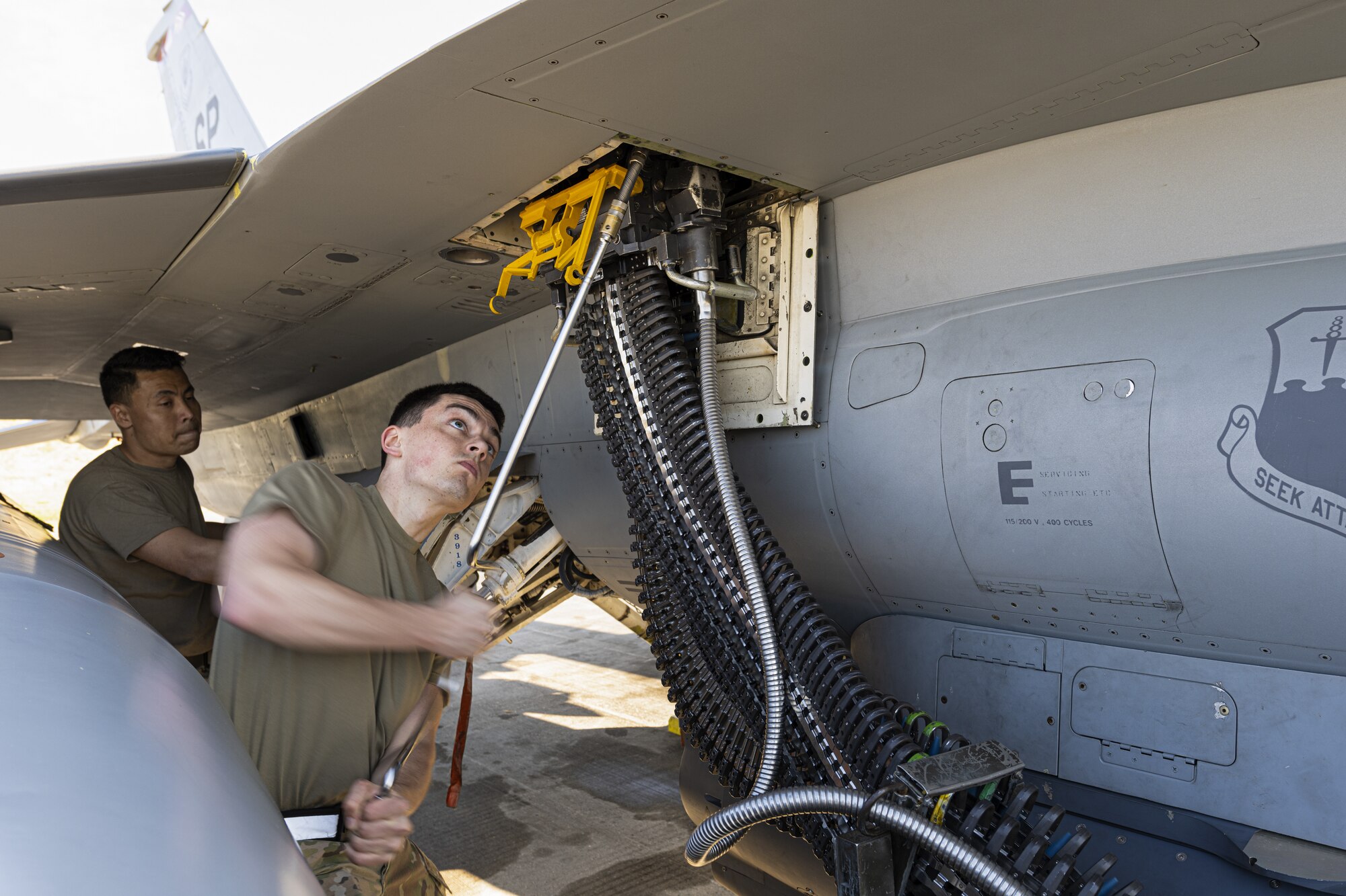 U.S. Air Force Airmen from the 52nd Maintenance Group at Spangdahlem Air Base, Germany, load ammunition into a U.S. Air Force F-16 at Kallax Air Base, Sweden, June 8, 2021. During the Arctic Challenge Exercise 21, 52nd MXS Airmen prepped the aircraft for over 450 sorties flown. (U.S. Air Force photo by Senior Airman Ali Stewart)