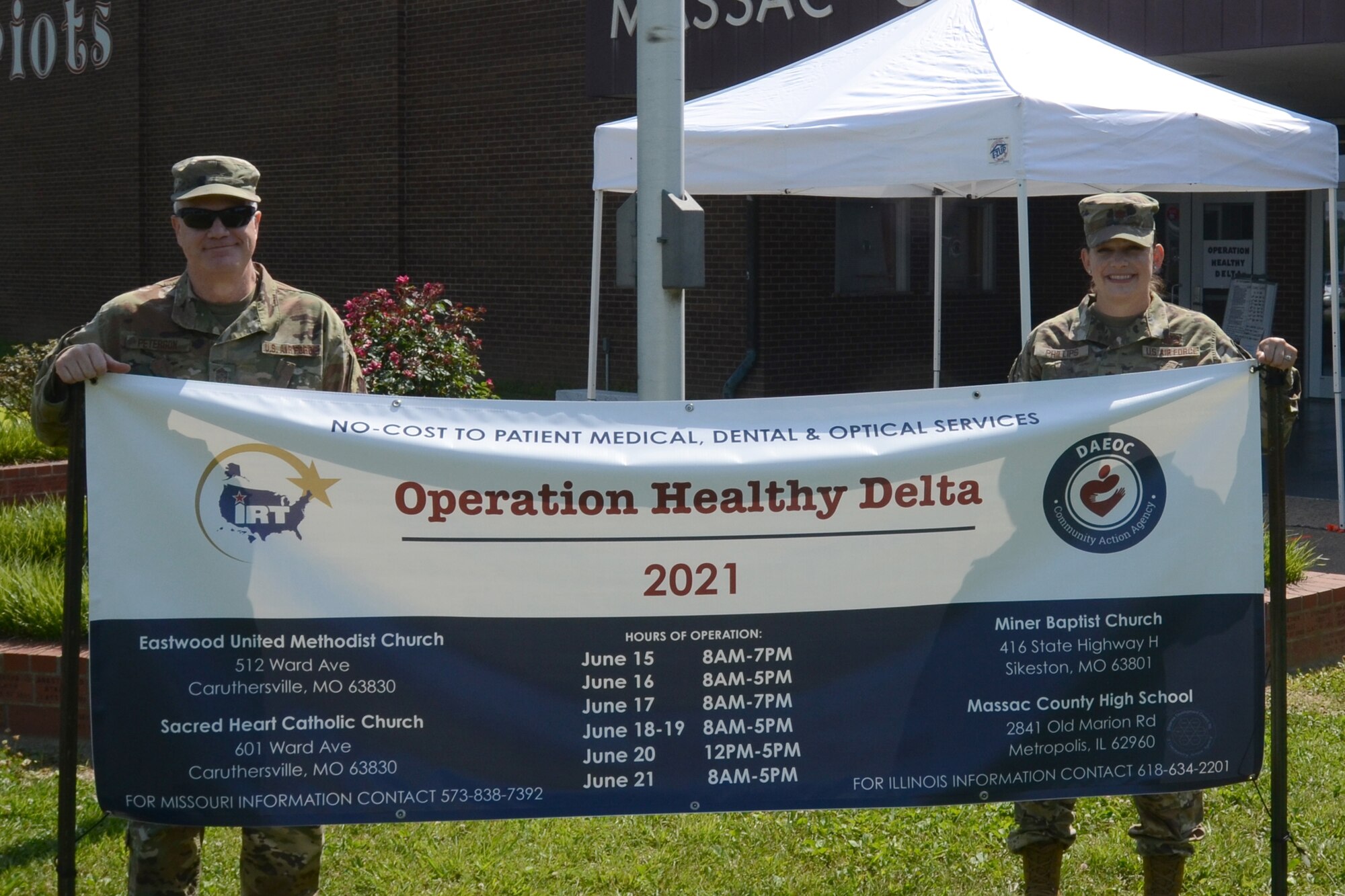 U.S. Air Force Maj. Rachel Phillips (right) and Chief Master Sgt. Dayne Peterson, assigned to the 169th Fighter Wing, McEntire Joint National Guard Base, South Carolina, visit Operation Healthy Delta, a Department of Defense sponsored Innovative Readiness Training program designed to provide military training opportunities by providing key services to local citizens. Phillips and Peterson visit operations at Massac County High School, Metropolis Illinois, June 17, 2021. (U.S. Air National Guard photo by Lt. Col. Jim St.Clair, 169th Fighter Wing Public Affairs)