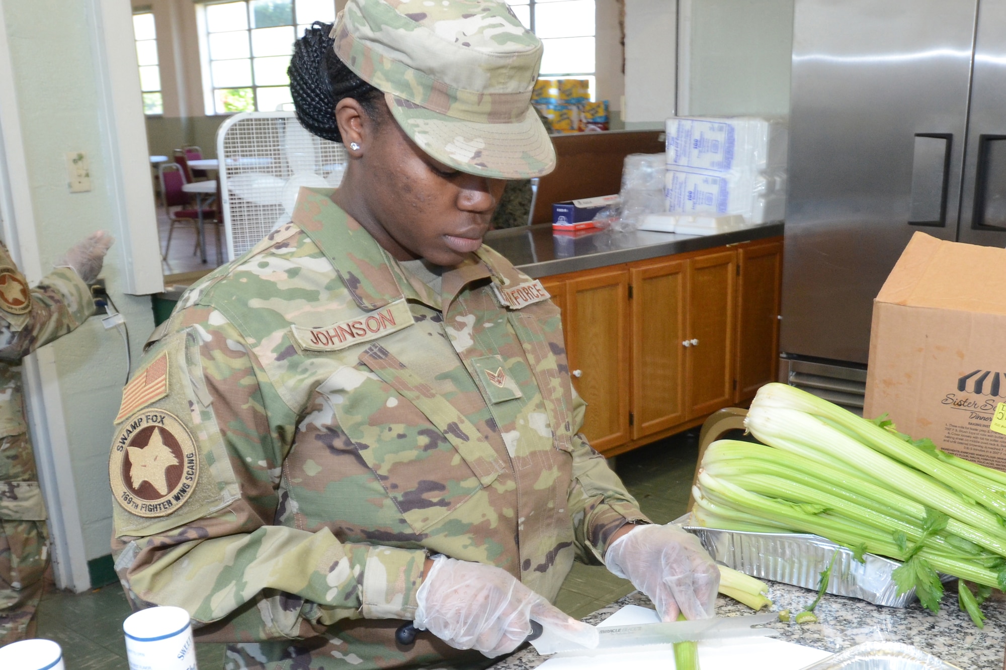 .S. Air Force Senior Airman Lakendra Johnson, food services specialist assigned to the 169th Fighter Wing, McEntire Joint National Guard Base, South Carolina, supports Operation Healthy Delta, a Department of Defense sponsored Innovative Readiness Training program designed to provide military training opportunities by providing key services to local citizens. Johnson is preparing food for the military personnel working at Caruthersville, Missouri June 15, 2021. (U.S. Air National Guard photo by Lt. Col. Jim St.Clair, 169th Fighter Wing Public Affairs)