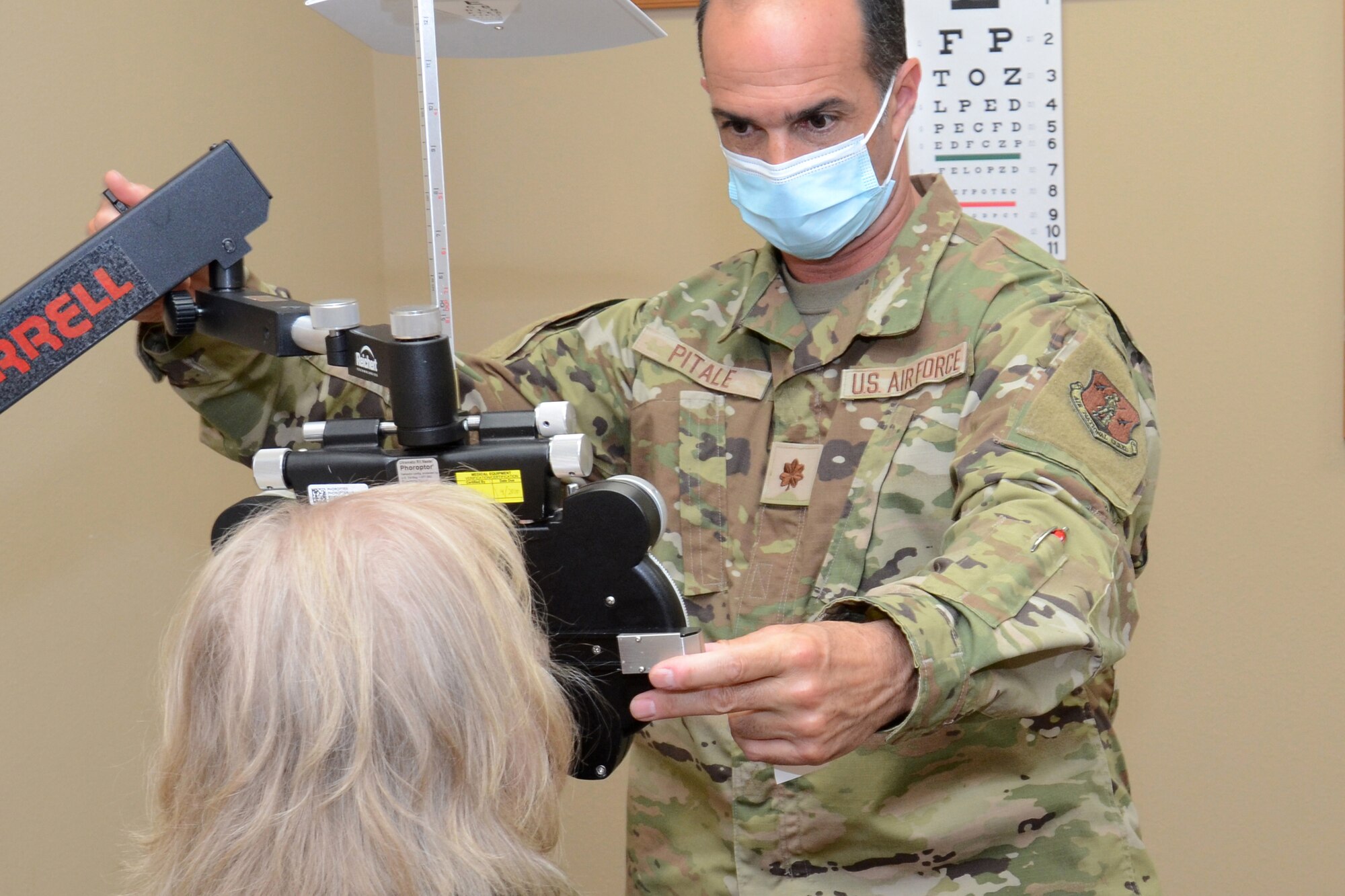 U.S. Air Force Maj. (Dr.) Sean Pitale, assigned to the 169th Fighter Wing, McEntire Joint National Guard Base, South Carolina, supports Operation Healthy Delta, a Department of Defense sponsored Innovative Readiness Training program designed to provide military training opportunities by providing key services to local citizens. Pitale is administering an eye exam at Sikeston, Missouri June 15, 2021. (U.S. Air National Guard photo by Lt. Col. Jim St.Clair, 169th Fighter Wing Public Affairs)