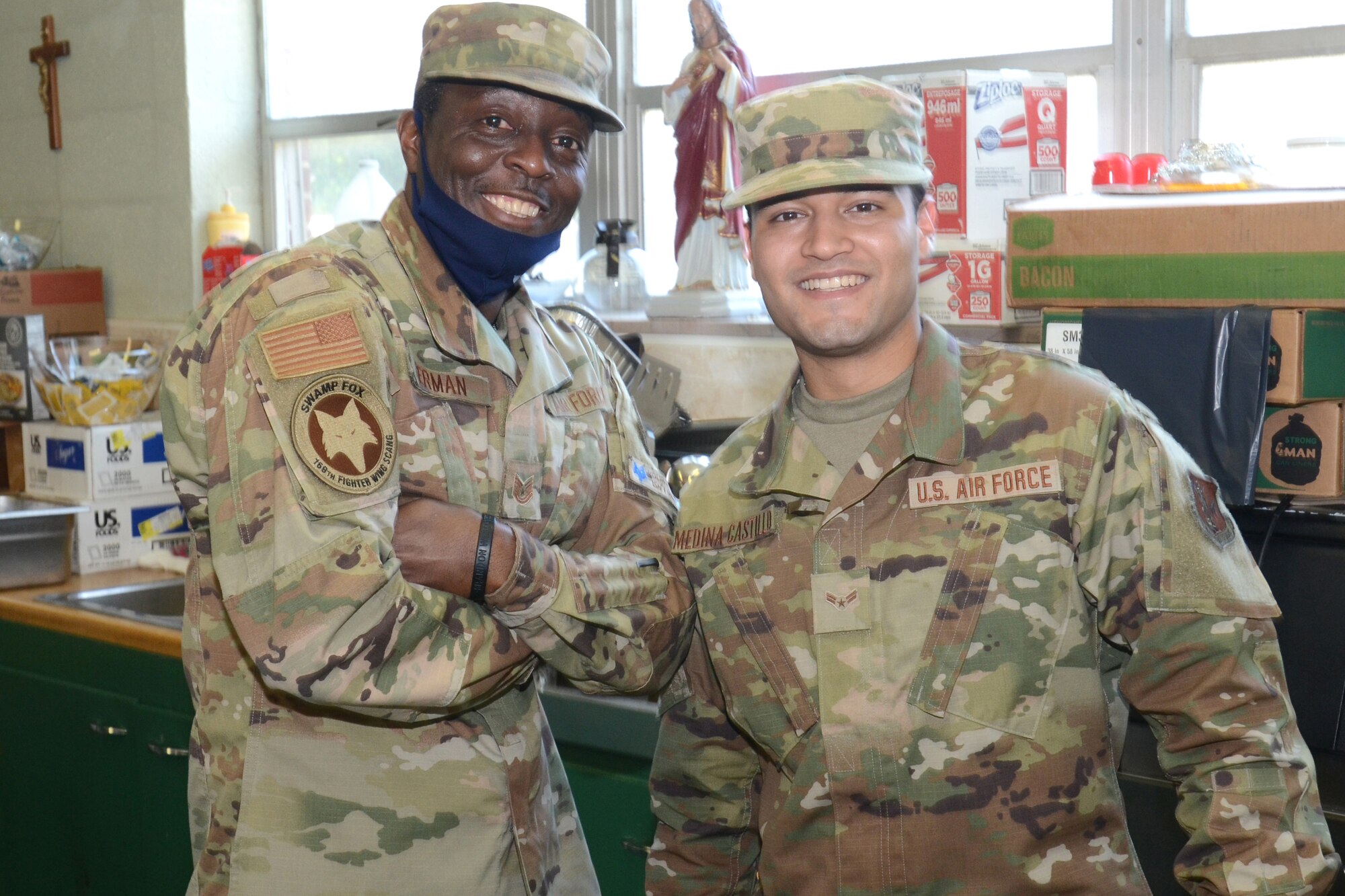 U.S. Air Force Tech. Sgt. Reggie German (left) and Airman Fernando Medina-Castillo, assigned to the 169th Fighter Wing, McEntire Joint National Guard Base, South Carolina, support Operation Healthy Delta, a Department of Defense sponsored Innovative Readiness Training program designed to provide military training opportunities by providing key services to local citizens. German and Medina-Castillo are serving at Sacred Heart Church in Caruthersville, Missouri June 17, 2021 (U.S. Air National Guard photo by Lt. Col. Jim St.Clair, 169th Fighter Wing Public Affairs)