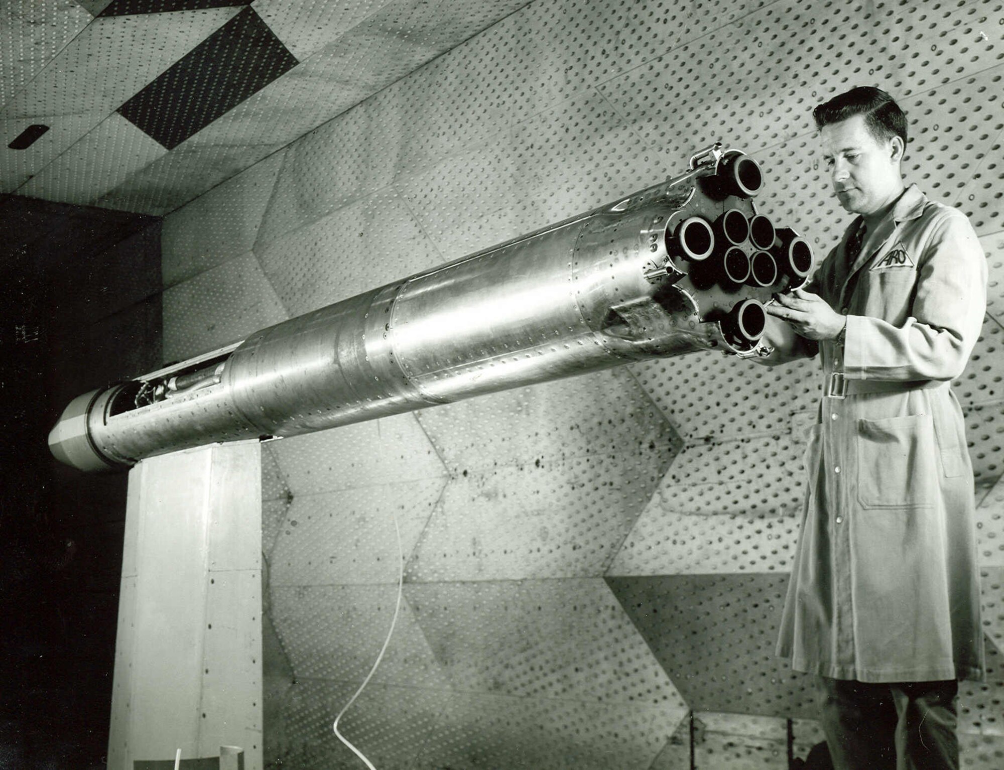 A 1/20th-scale model of first-stage Saturn is prepared for testing in the 16-foot transonic wind tunnel at Arnold Air Force Base in the early 1960s. The purpose of the testing was to study base heating encountered by the space booster’s first stage as it accelerated to supersonic speeds and out of the earth’s atmosphere. (U.S. Air Force photo)