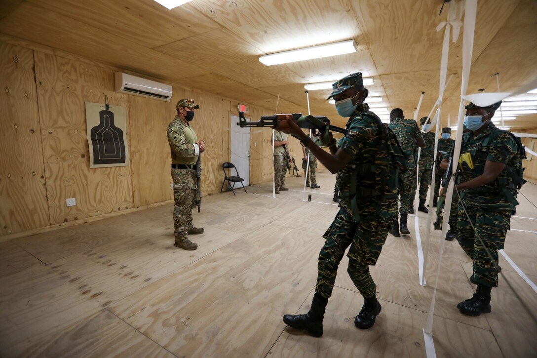 U.S. Soldiers from the Florida Army National Guard's (FLARNG) 2-54 Security Force Assistance Brigade (SFAB) and Drug Enforcement Administration (DEA) agents instruct Guyana Defence Force (GDF) Soldiers on room clearing tactics.