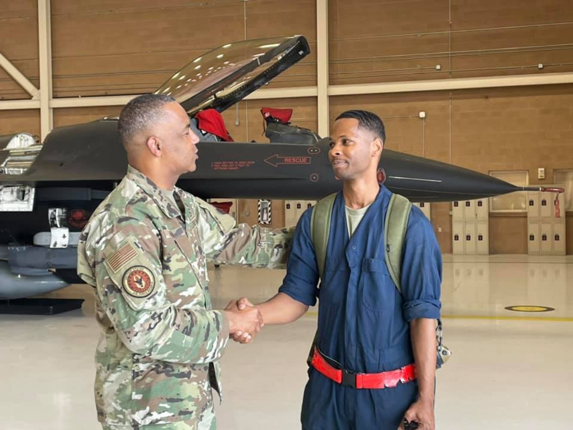 Chief Master Sgt. Timothy White, Senior Enlisted Advisor to the Chief of Air Force Reserve and Command Chief Master Sergeant of Air Force Reserve Command, greets Staff Sgt. Aaron Raiford, 926th Aircraft Maintenance Squadron, during a visit to the 926th Wing, June 16, at Nellis Air Force Base, Nevada. White is visiting as part of the Reserve Senior Enlisted Council hosted by 10th Air Force. (U.S. Air Force photo by Natalie Stanley)