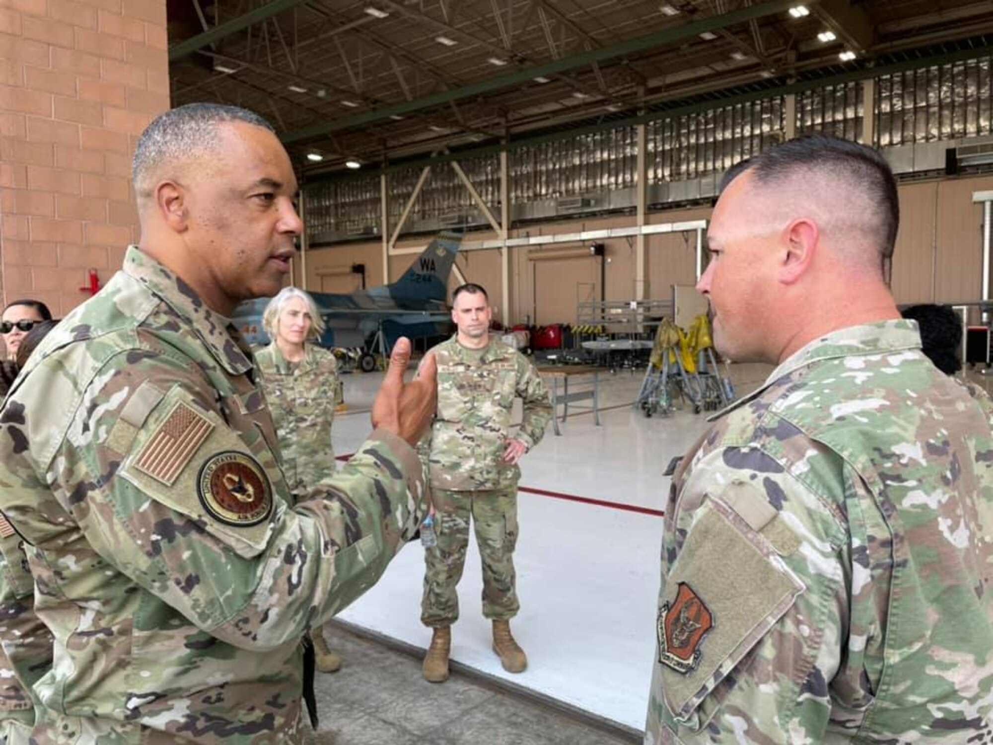 Chief Master Sgt. Timothy White, Senior Enlisted Advisor to the Chief of Air Force Reserve and Command Chief Master Sergeant of Air Force Reserve Command, speaks with Senior Master Sgt. Seth Little ,926th Aircraft Maintenance Squadron, during a visit to the 926th Wing, June 16, at Nellis Air Force Base, Nevada. Little explained the role of the 926th AMXS on Nellis AFB. White is visiting as part of the Reserve Senior Enlisted Council hosted by 10th Air Force. (U.S. Air Force photo by Natalie Stanley)