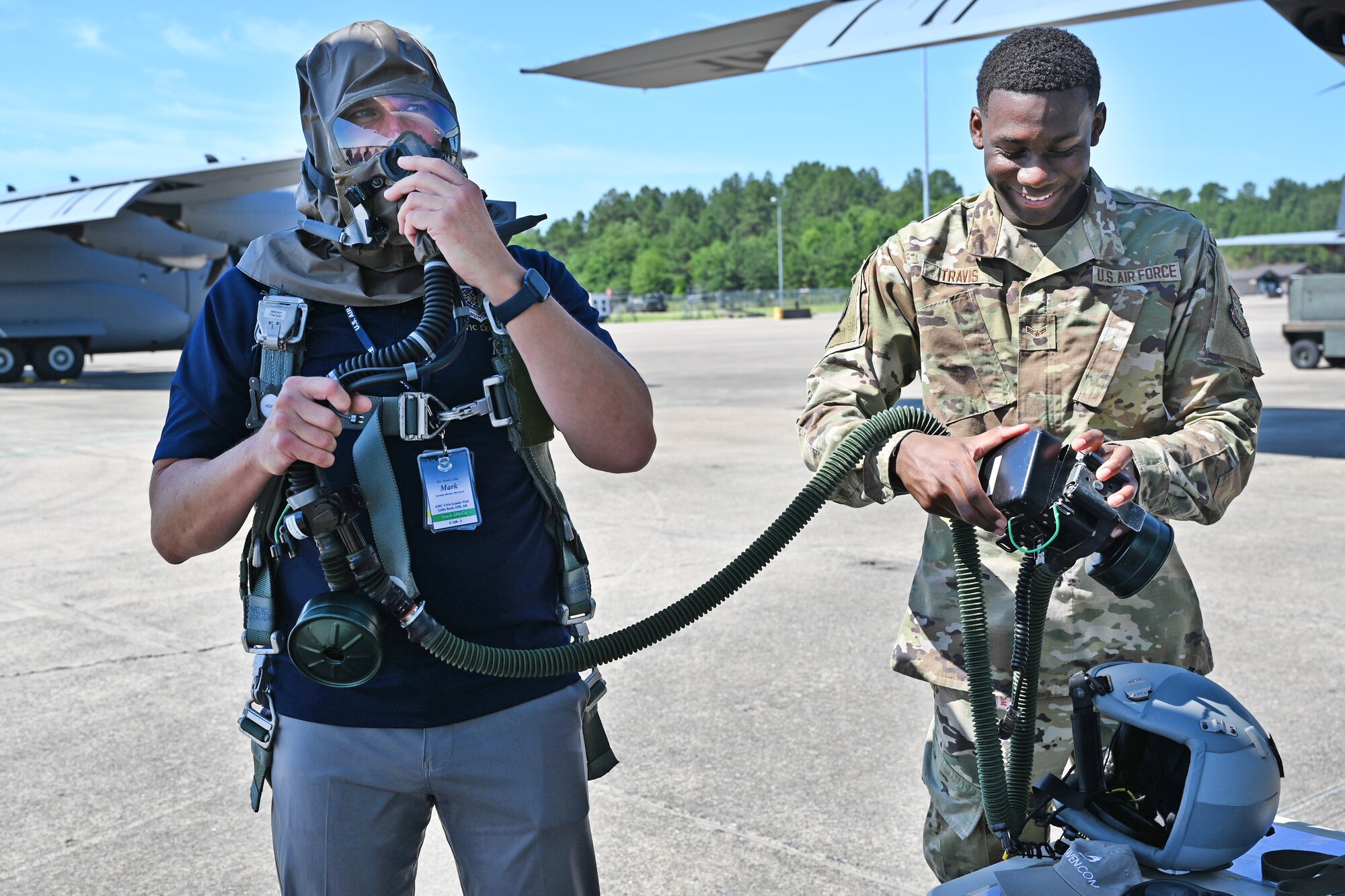 Mark Lillis, Air Mobility Command Civic Leader representing Travis Air Force Base, California, tries on an aircrew eye and respiratory protection system mask