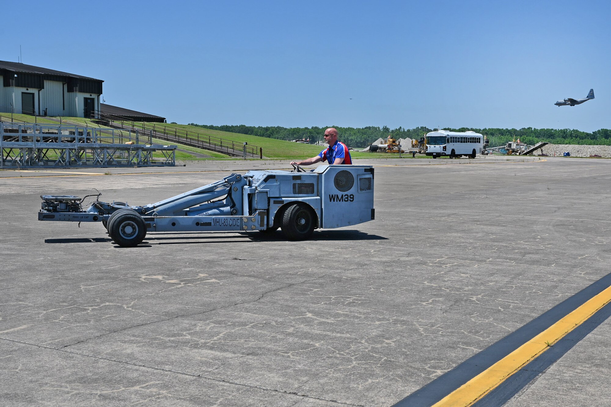 Bobby Pancake, Air Mobility Command Civic Leader representing Dover Air Force Base, Delaware, drives a bomb lifter while touring the 34th Combat Training Squadron
