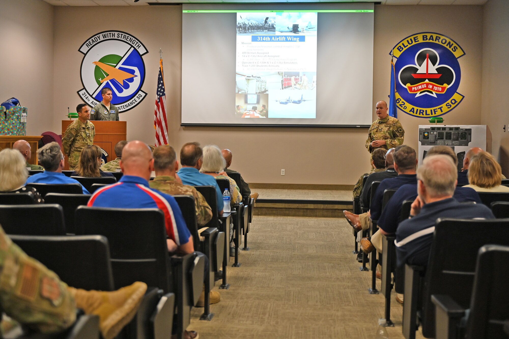 Lt. Col. Matt Wunderlich, 62d Airlift Squadron commander, briefs Air Mobility Command Civic Leaders about the mission sets of the 62d AS and 714th Training Squadron